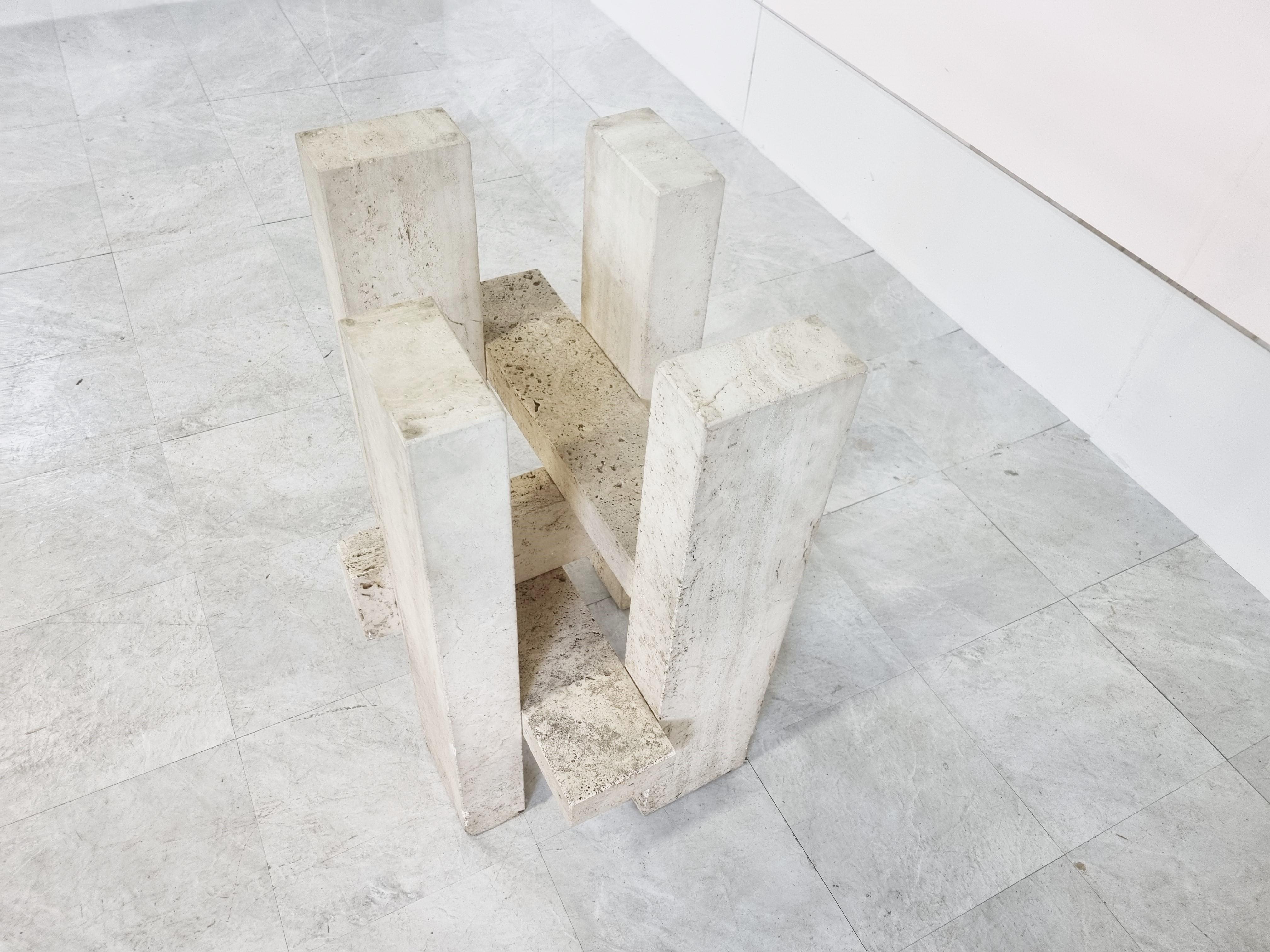 Rare architectural travertine dining table by Willy ballez consisting of a solid travertine base with a clear glass top.

The table looks great thanks the the rough travertine that has been used and has a playful design.

Condition: Base has