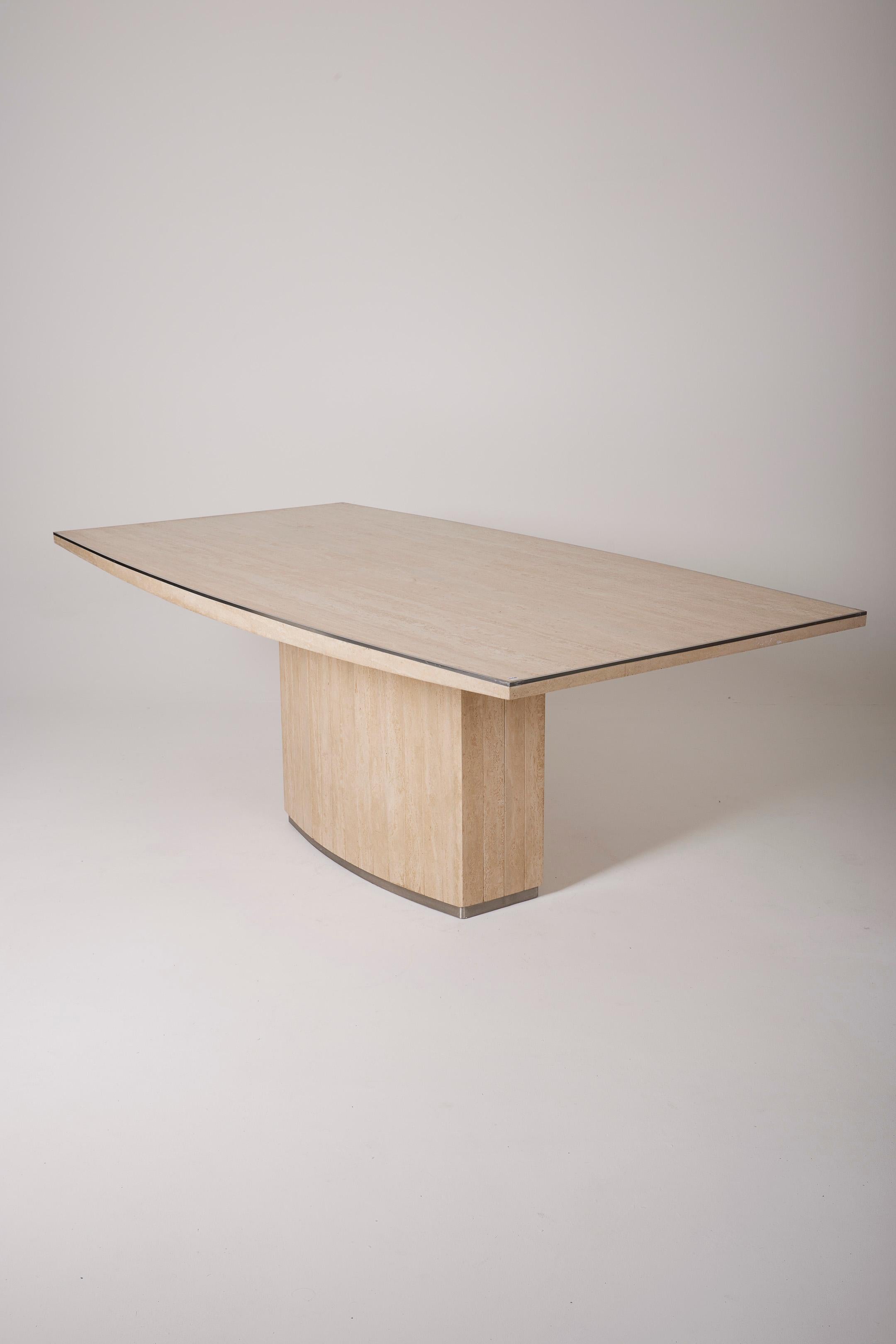 Large travertine dining table by Italian designer Willy Rizzo from the 1970s. The table is made of travertine, with silver trim around the edge of the tabletop and base. A very beautiful piece.
LP3022
