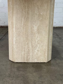 Travertine dining table with rounded edges