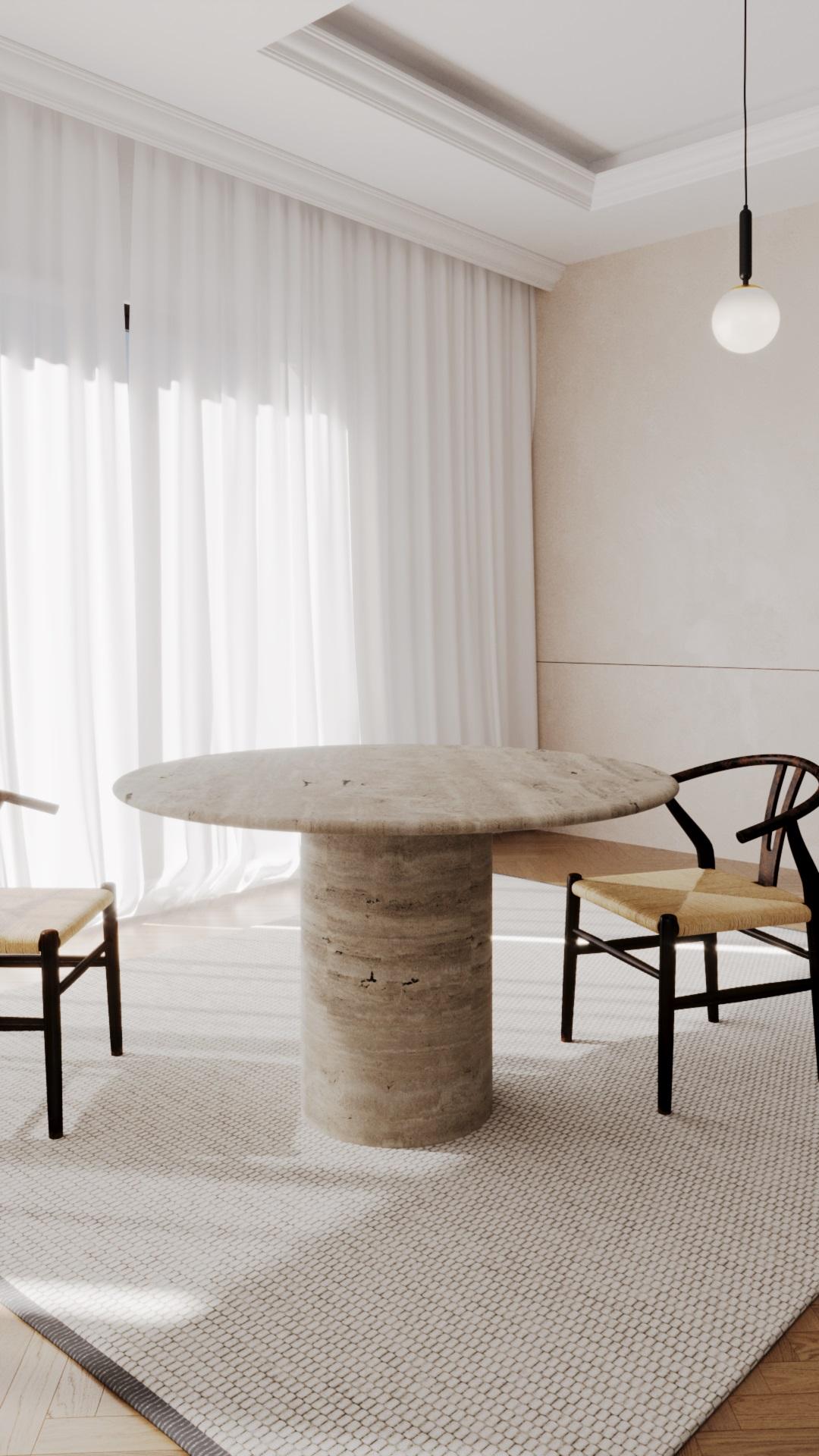 The round dining table takes its inspiration from the organic and flowing forms found in nature. It seamlessly combines the world's finest materials to create connections that are breathtaking in their simplicity. Whether you're enjoying a