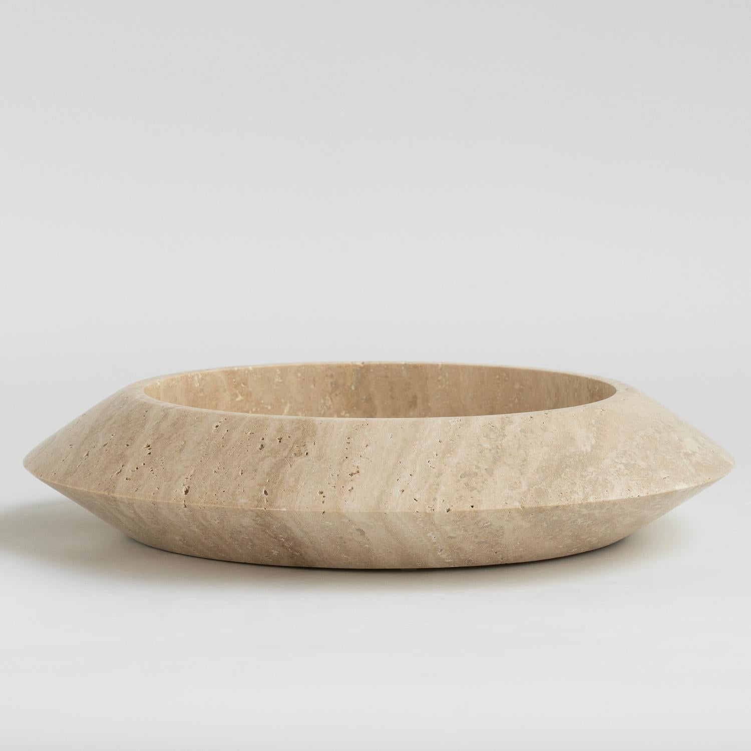 Stunning, aesthetic, timeless are words that can be used to describe this elegant and modern travertine Eclipse bowl from Kiwano. Expertly crafted and finished by hand, our travertine bowls are a study in sculptural simplicity. Natural variations in