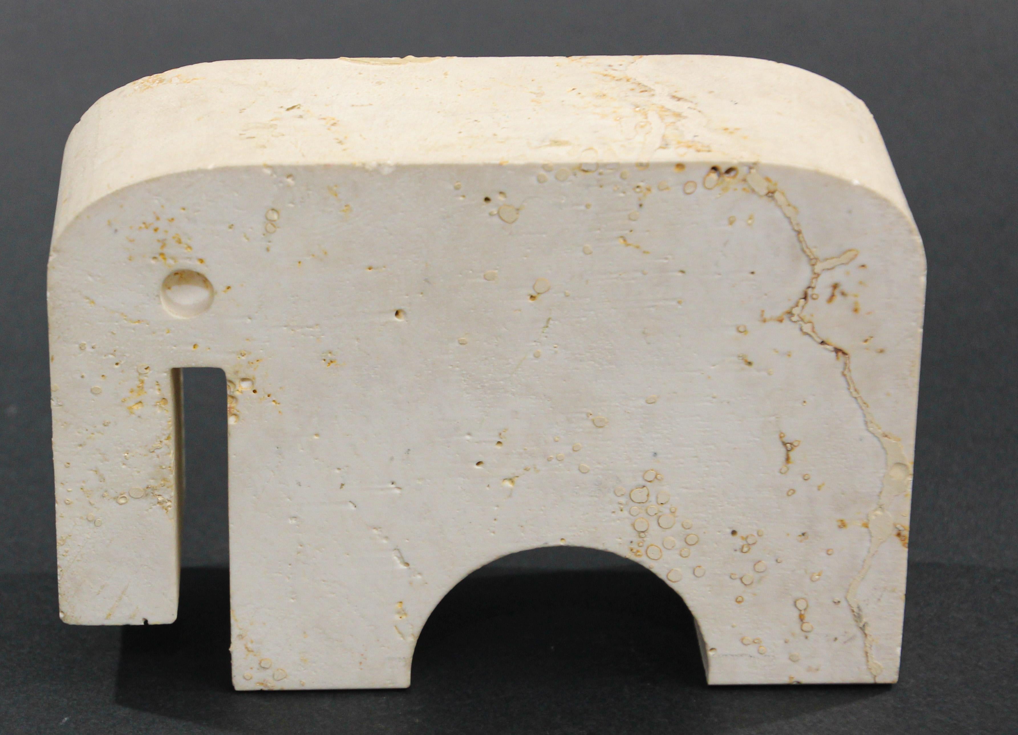 Vintage textured travertine elephant by Fratelli Mannelli for Raymor, 
Collectible vintage hand carved travertine elephant by Fratelli Mannelli for Raymor.
Vintage abstract Fratelli Mannelli travertine modern design, clean, stylized sculpture of