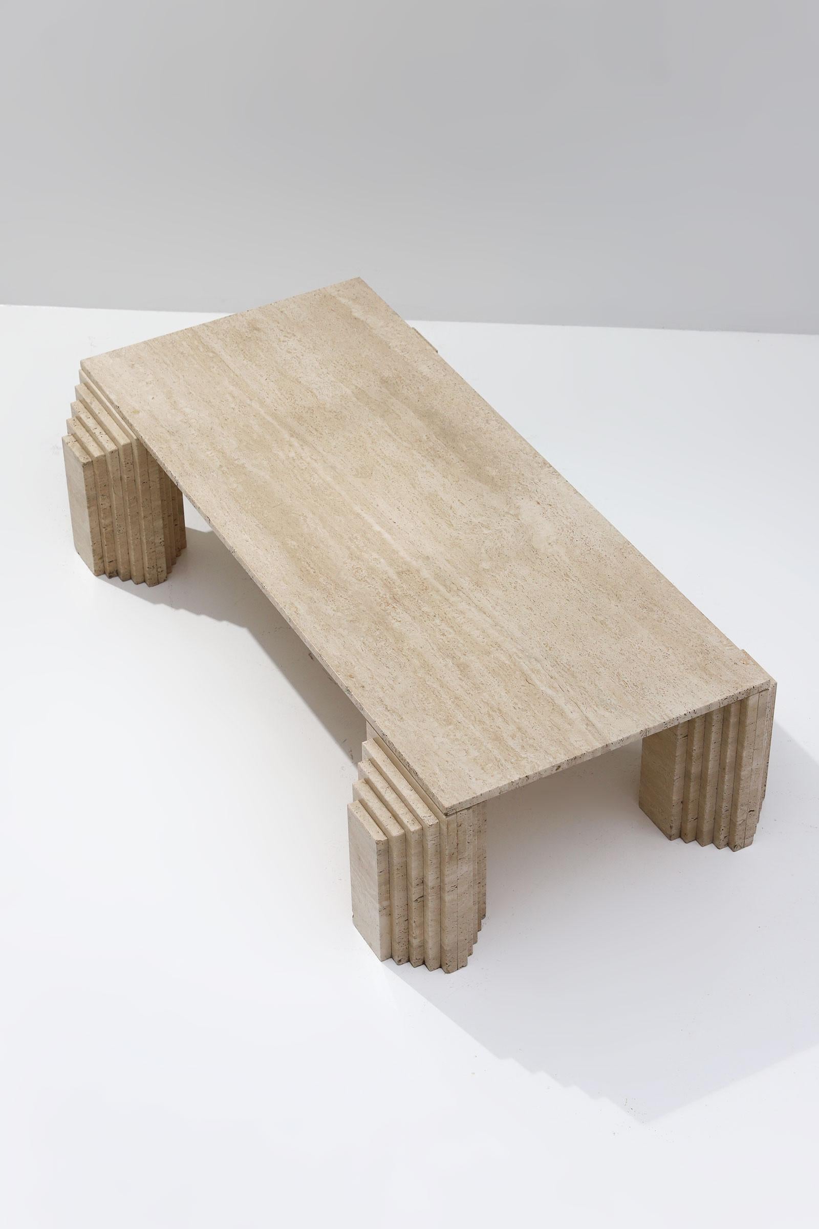 Scarpa, travertine, coffee table, Postmodern, Italy, 1970s

Beautiful travertine coffee table made in the 1970s. The rectangular tabletop rests on four block legs that have a stair-shaped architectural form. The high legs and a variegated color