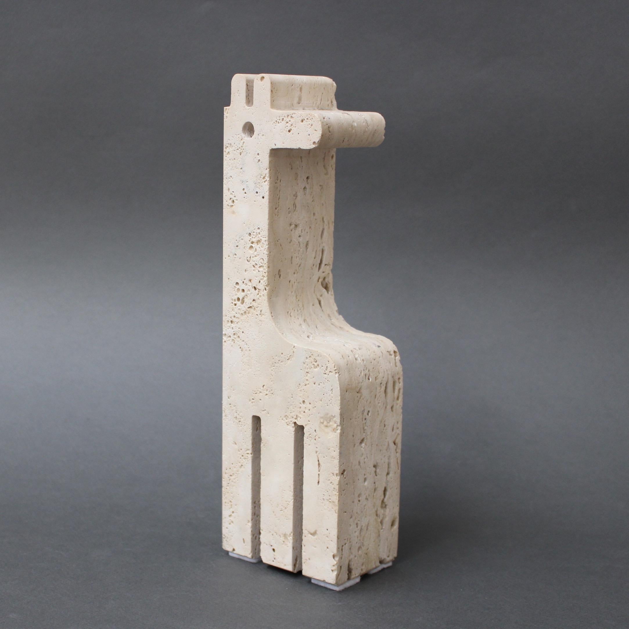 Travertine giraffe table sculpture by Mannelli Bros., Italy, (circa 1970s). Heartwarming travertine stylised giraffe will delight art lovers and collectors. Minimalist in style with soft curves and lines, this sculpture may be displayed as a work of