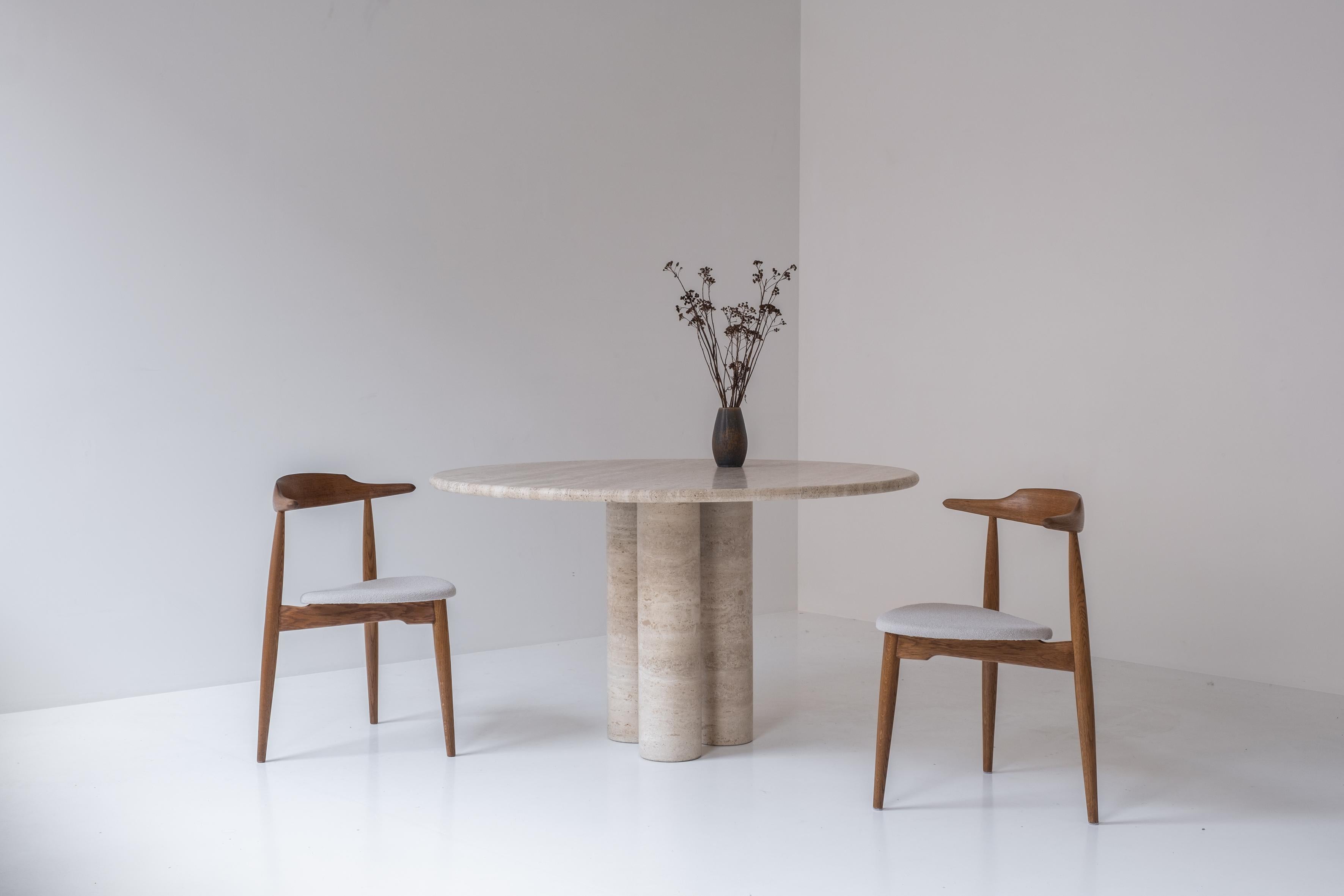 Admire this lovely round dining table by Mario Bellini for Cassina, Italy 1970s. This Il Colonnato table is made out of travertine and features three cylindrical columns holding the top with round edges. This is a very rare table as this model was
