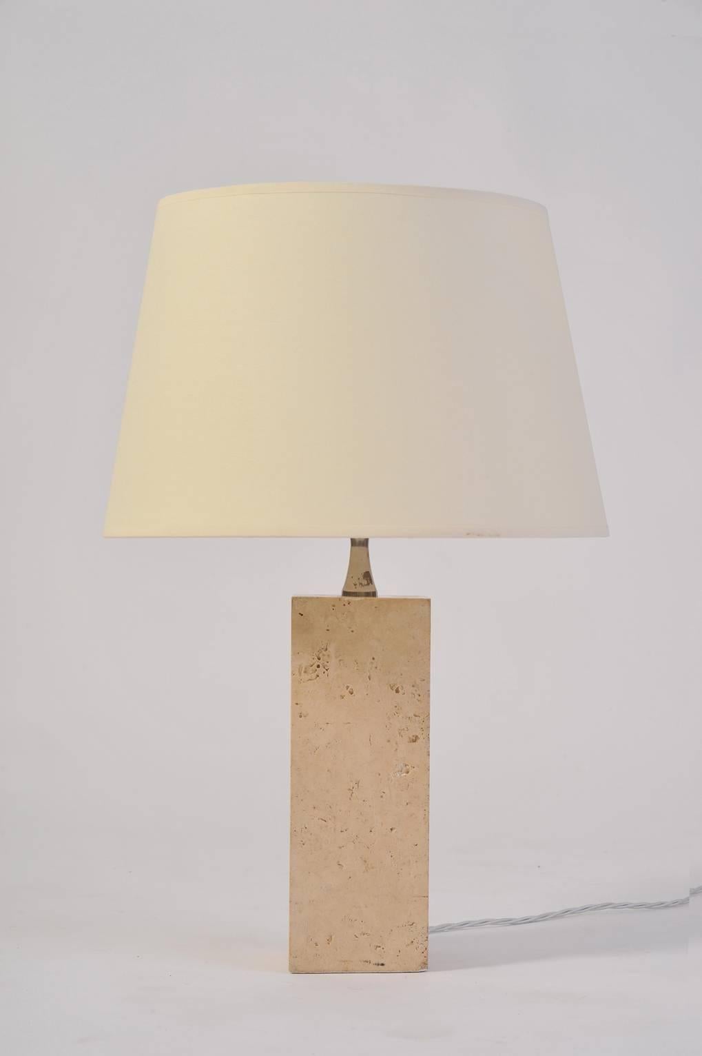 A travertine square column table lamp, by Maison Barbier
France, circa 1970.