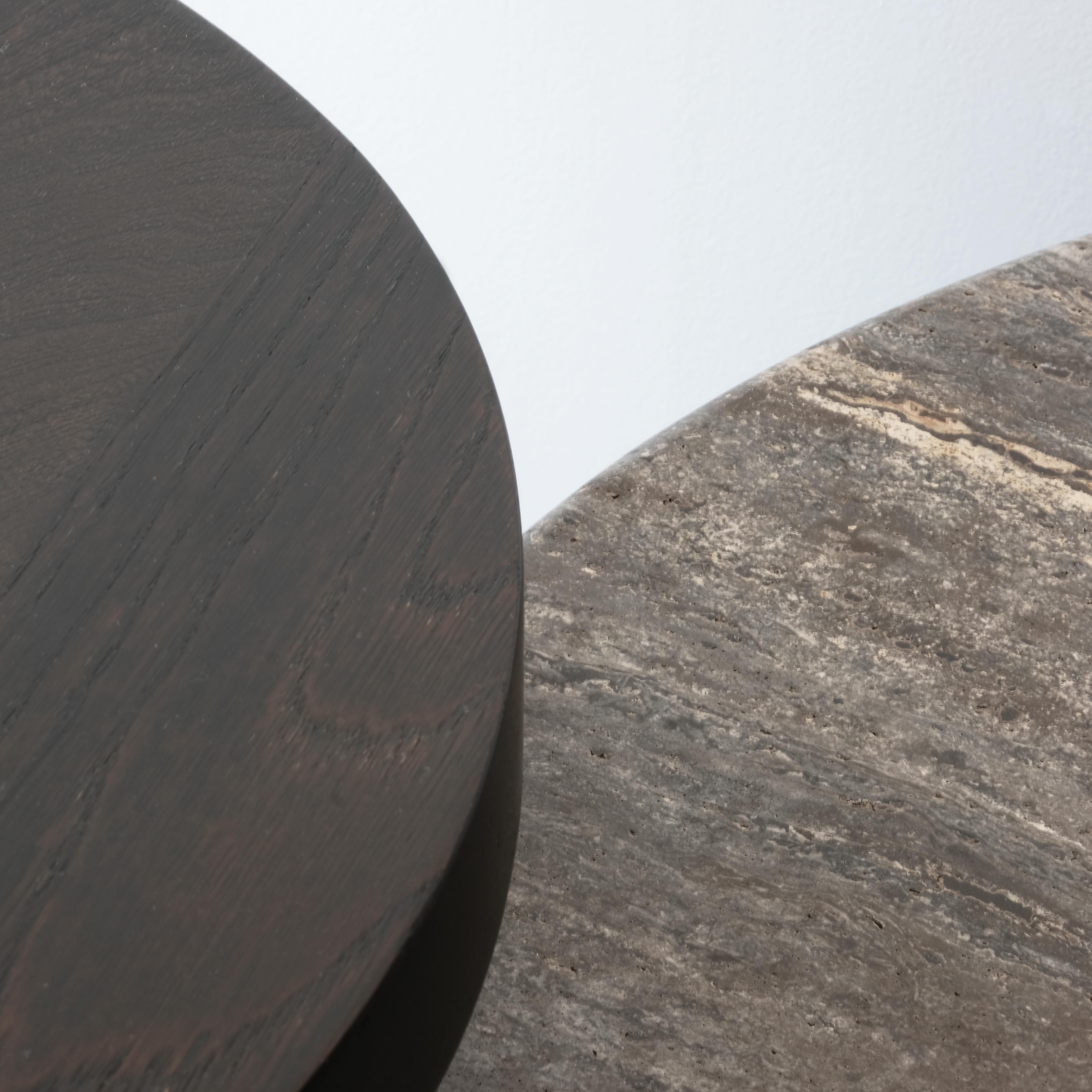 DOCIA series travertine marble dining table is a timeless table that combines natural materials with modern design. The travertine table top exhibits the unique patterns of natural marble, while its legs consist of independent solid oak slats shaped