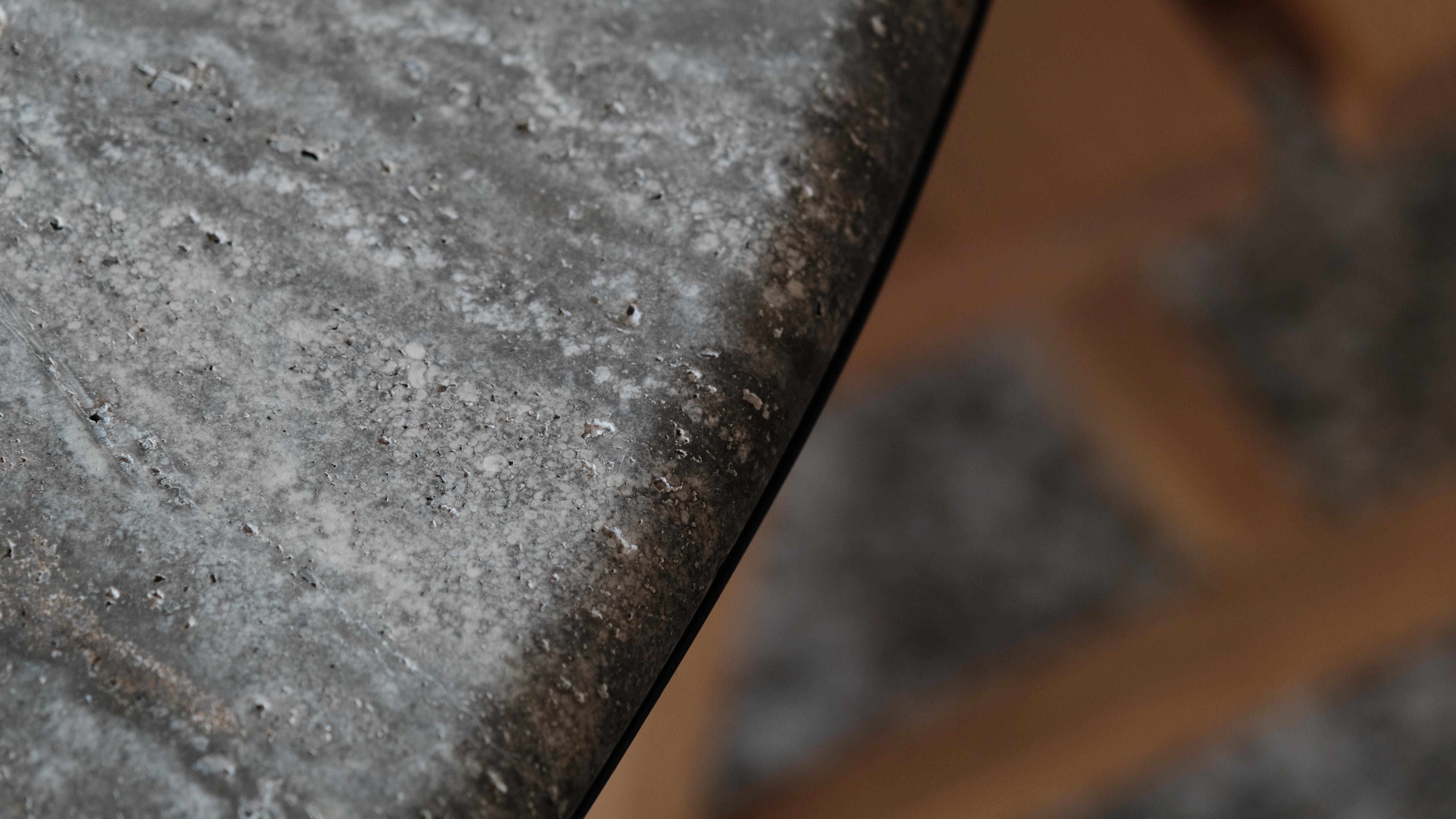 DOCIA series travertine marble dining table is a timeless table that combines natural materials with modern design. The travertine table top exhibits the unique patterns of natural marble, while its legs consist of independent solid oak slats shaped