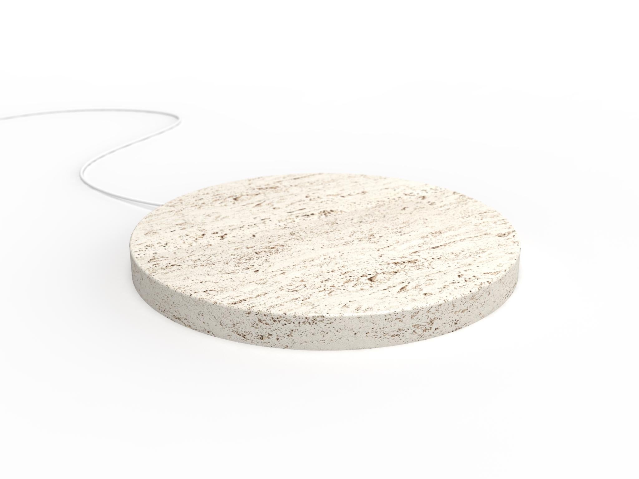 A travertine base,
that quickly charge your phone, with a touch of magic.
 
A circle, 
a stone, 
realized with the care that stone requires.

A powerful wireless charging technology ensures an efficient and reliable power delivery.

The result is a