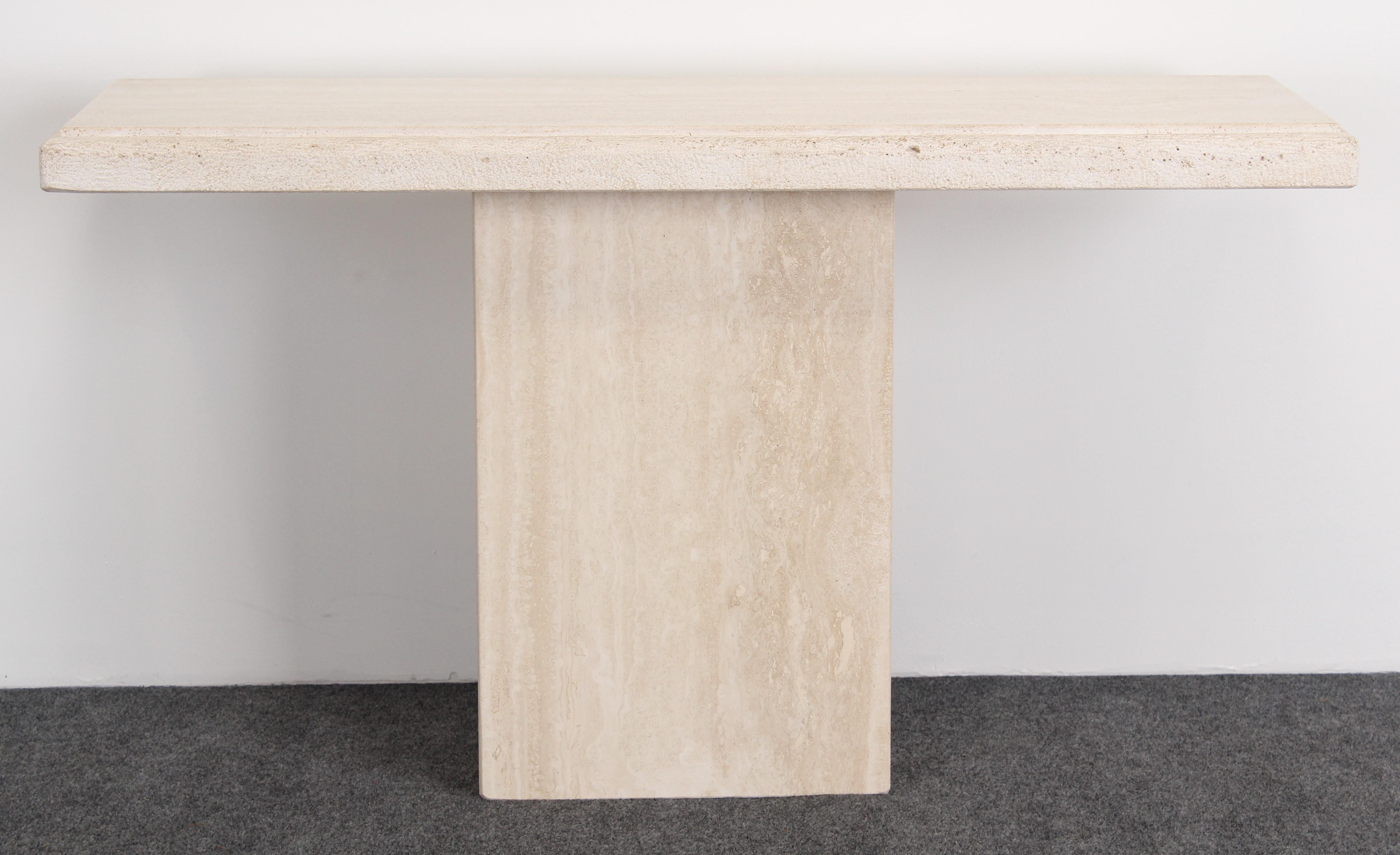 A beautiful solid travertine marble console table. Sturdy and functional for any interior space. Great condition with age appropriate wear.