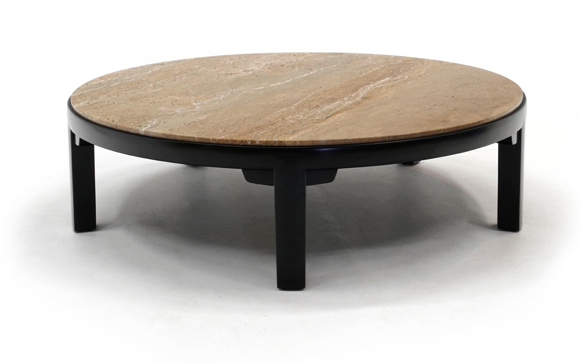 Stunning round coffee table designed by Edward Wormley for Dunbar, 1950s. The base has been expertly restored and refinished. The travertine marble top is original and in very good condition. No water marks, no chips or crack. Beautiful veining in