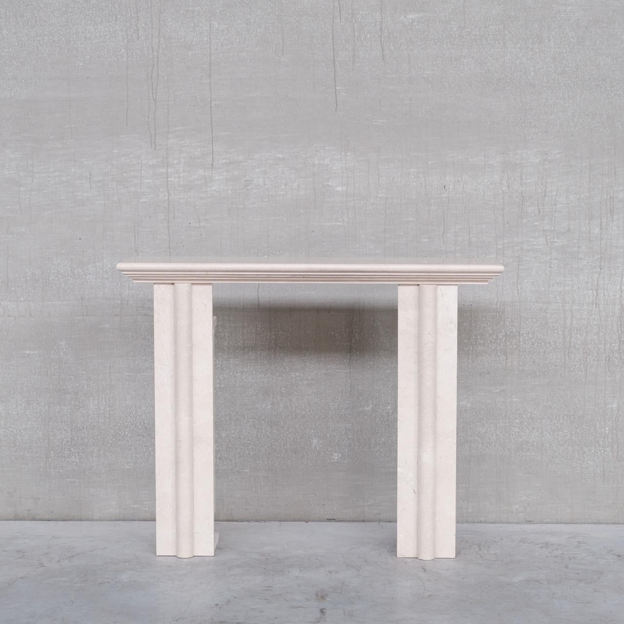 A travertine Belgium wall console. 

Two pillars with an elegant single shelf. 

Belgium, c1980s. 

Unusually it is open internally from the inside corners, priced accordingly. 

Location: Belgium Gallery. 

Dimensions: 128 W x 27 D x 101