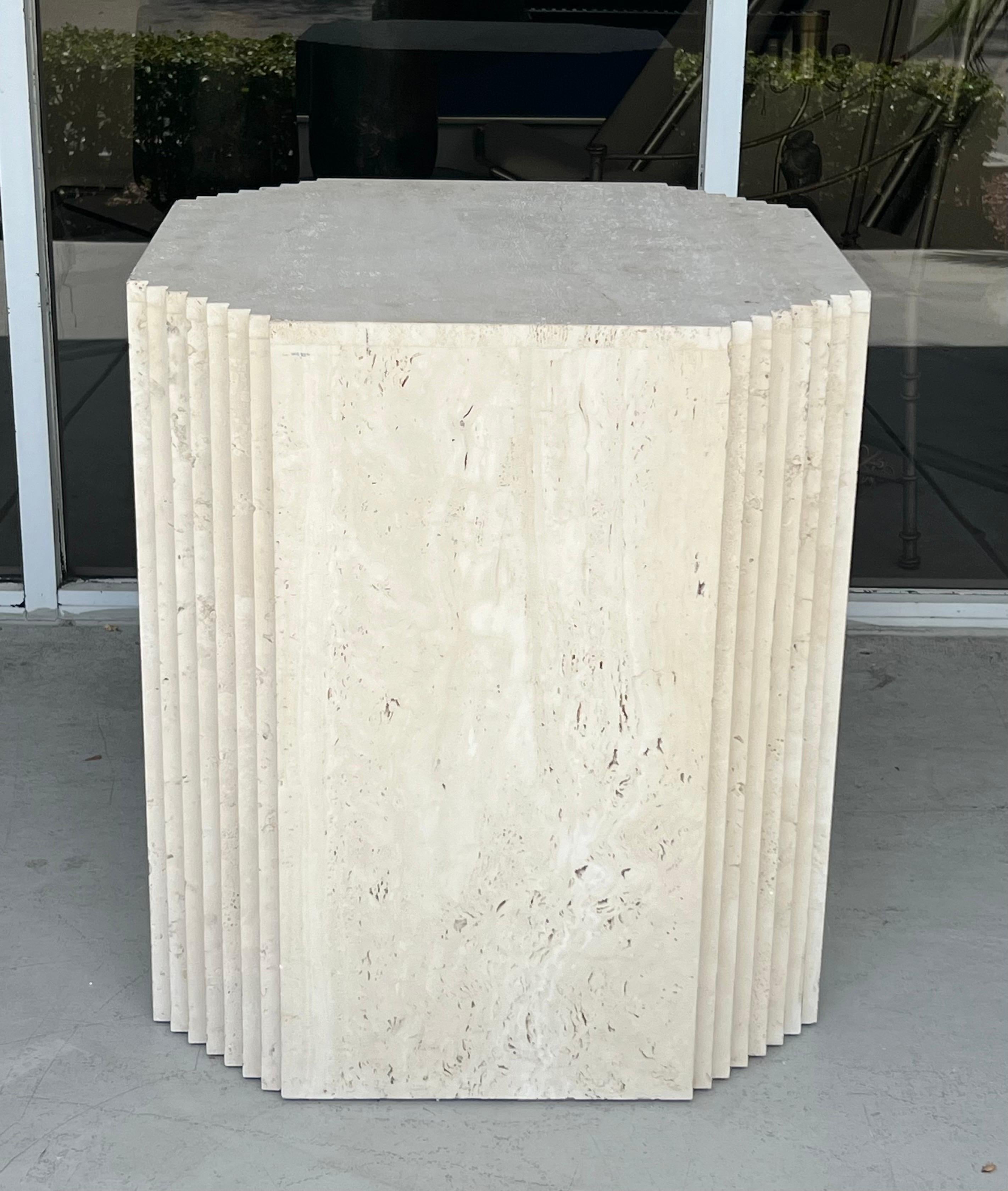 A travertine base. Could be used as a stand alone piece, or as a base for a table.
Can acomódate a round, square or rectangular top.  