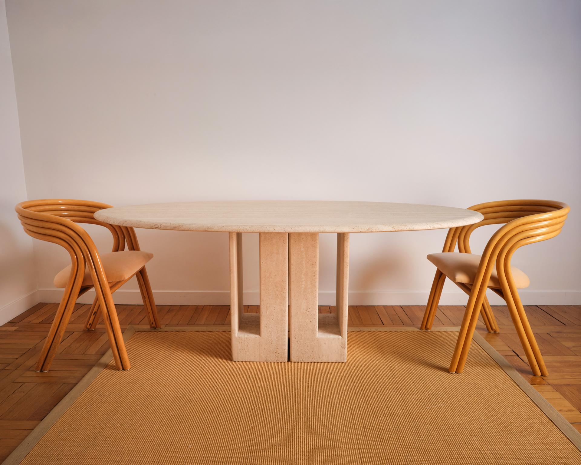 Oblong travertine dining table, direct from the workshop of Claude Berraldacci. France, 20th century.

The profile of the legs is characterized by the sculptural work in the material, typical of Berraldacci tables.

There is a large travertine