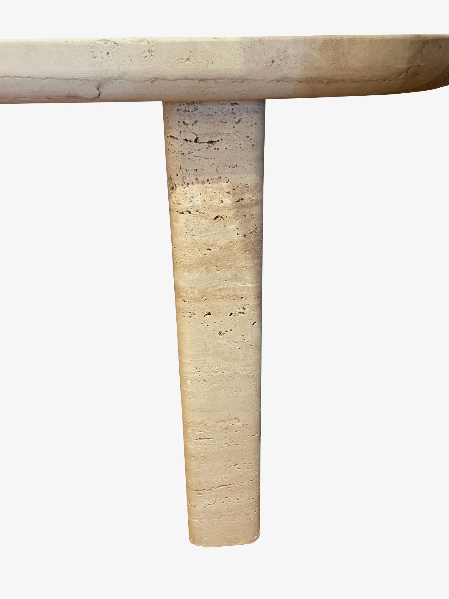 1980's Italian travertine console table.
Oval shaped top.
Unfilled and honed finish.