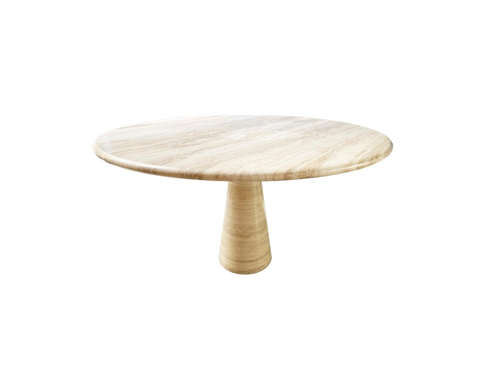 A round Italian travertine pedestal dining table, Italy, circa 1980s. 
Modern and minimalist design. 

The marvel of this Italian table design is the top balances perfectly and securely by it's own weight.
Beautiful grain pattern with a filled and