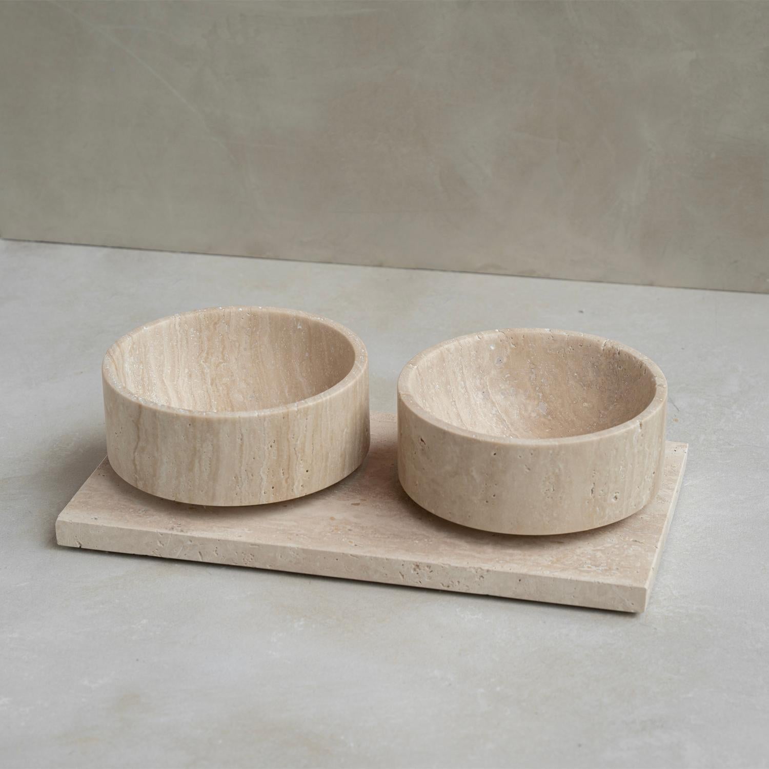 Unique and Stunning Pet bowl made of travertine stone. Expertly crafted and finished by hand, our travertine bowls are a study in sculptural simplicity. Natural variations in the stone's distinctive veining, tonal hues and organic texture reveal the