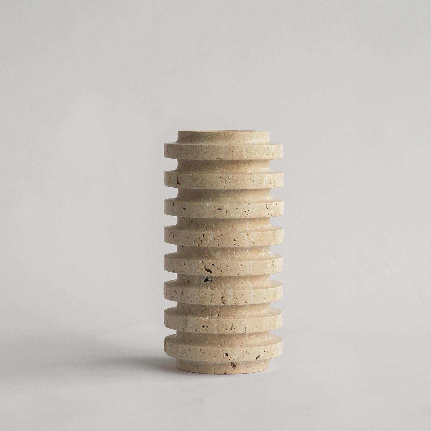 Stunning, aesthetic, timeless are words that can be used to describe this elegant and modern travertine vase from Kiwano. Expertly crafted and finished by hand, our travertine vases are a study in sculptural simplicity. Natural variations in the