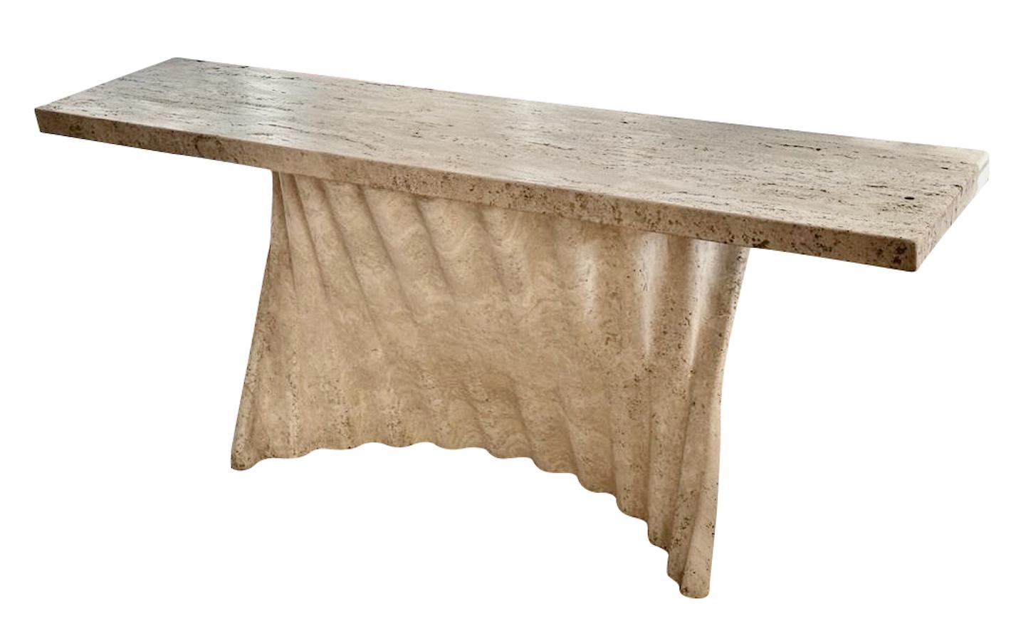 1970's Spanish unusual and exceptional travertine console with sculpted base and vertical reed design.
Honed and unfilled finish.
