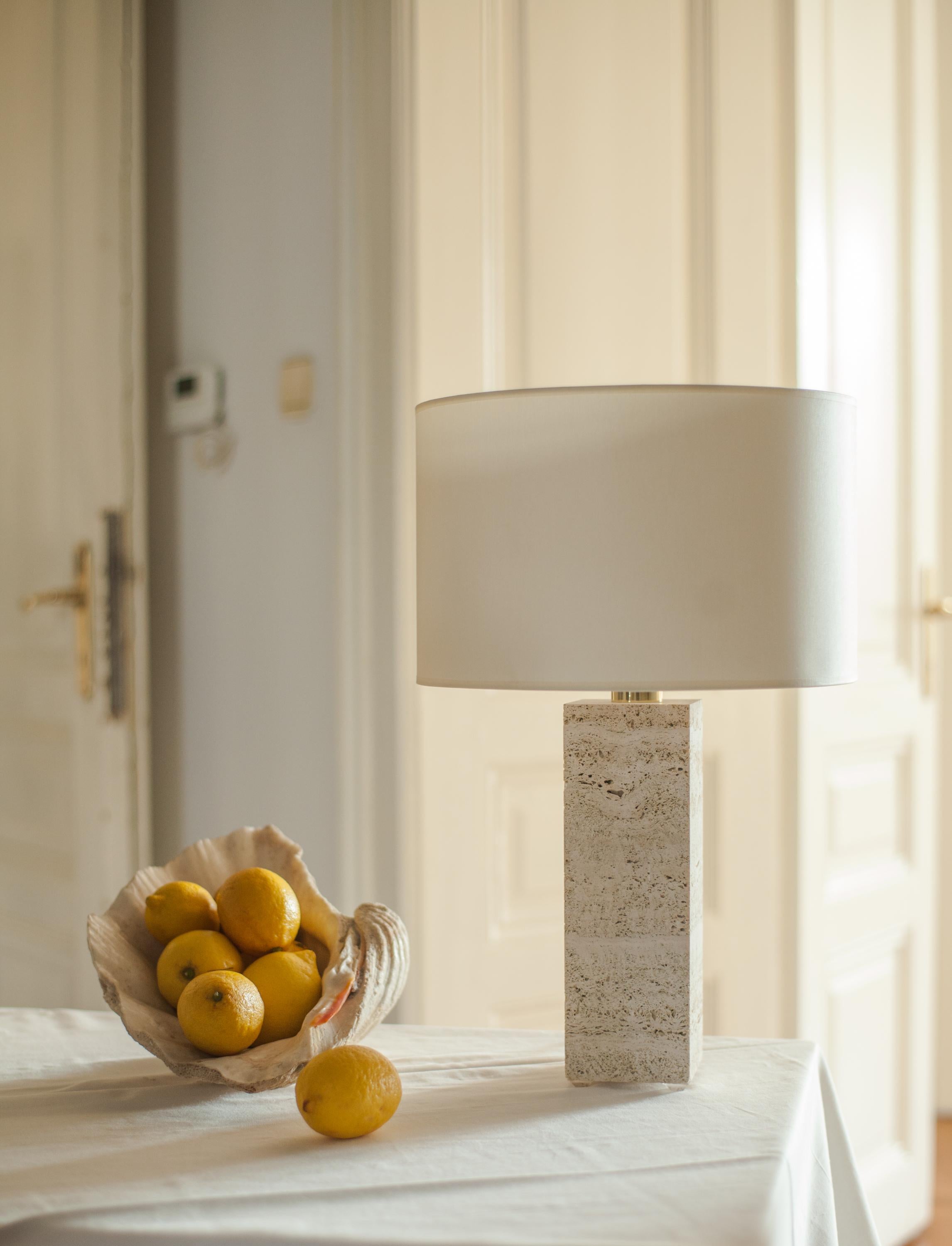 Travertine Sculpted Table Lamp by Brajak Vitberg
Travertine, Polished brass
Dimensions: 52 x 35 x 35 cm
white or black cotton lampshade, cotton wiring


Bijelic and Brajak are two architects from Ljubljana, Slovenia.
They are striving to design