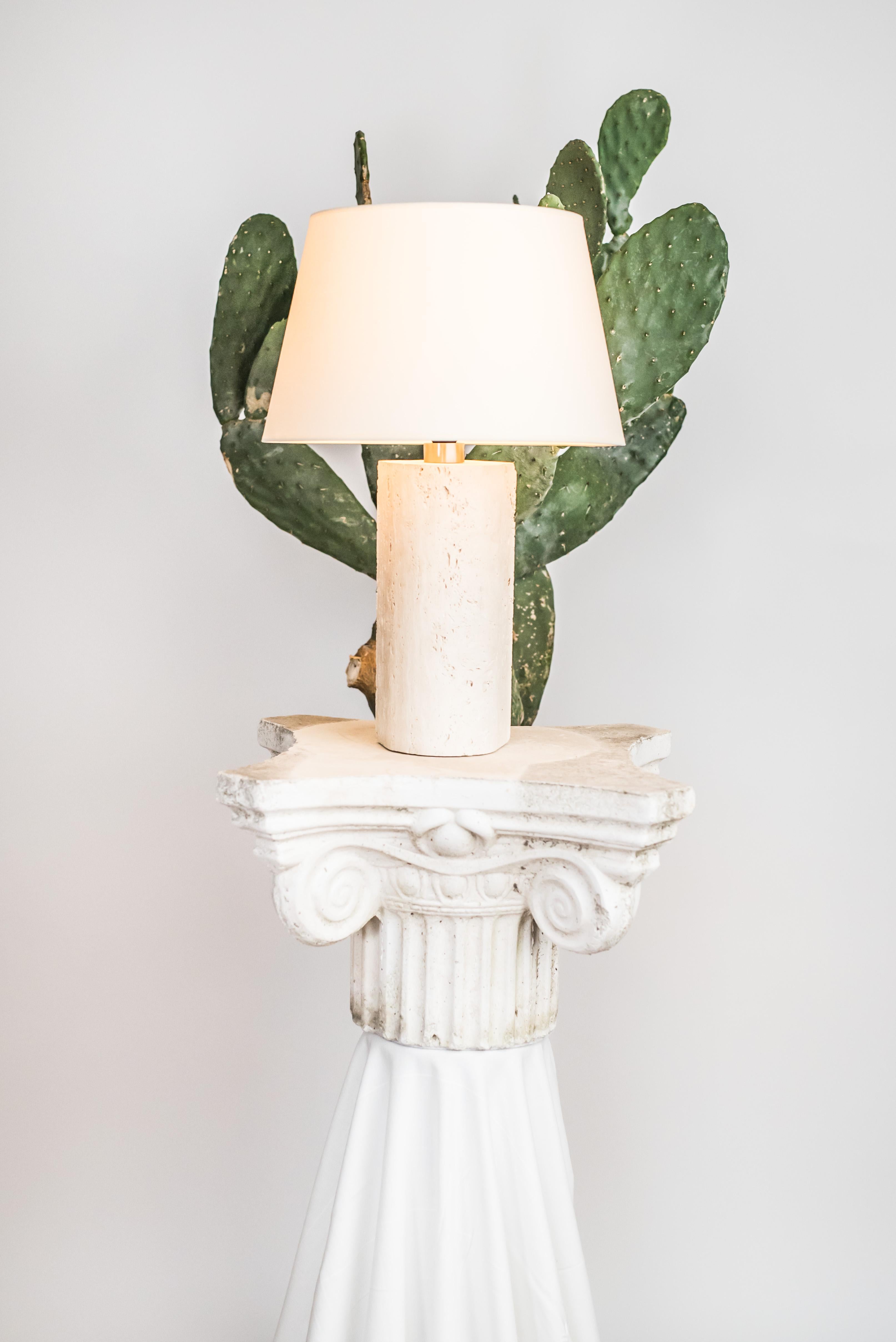 Travertine sculpted table lamp by Brajak Vitberg
CAPRI 1.2.
Travertine, Polished brass
Dimensions: 52 x 35 x 35 cm
white or black cotton lampshade, cotton wiring


Bijelic and Brajak are two architects from Ljubljana, Slovenia.
They are striving to