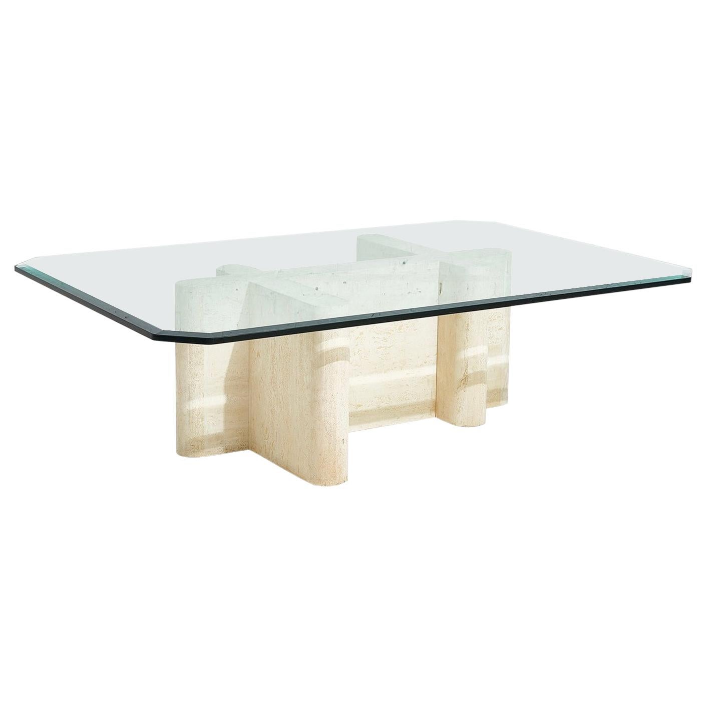 Sculptural travertine coffee table. Made in Italy circa 1970’s. Solid travertine marble base with glass top.
  