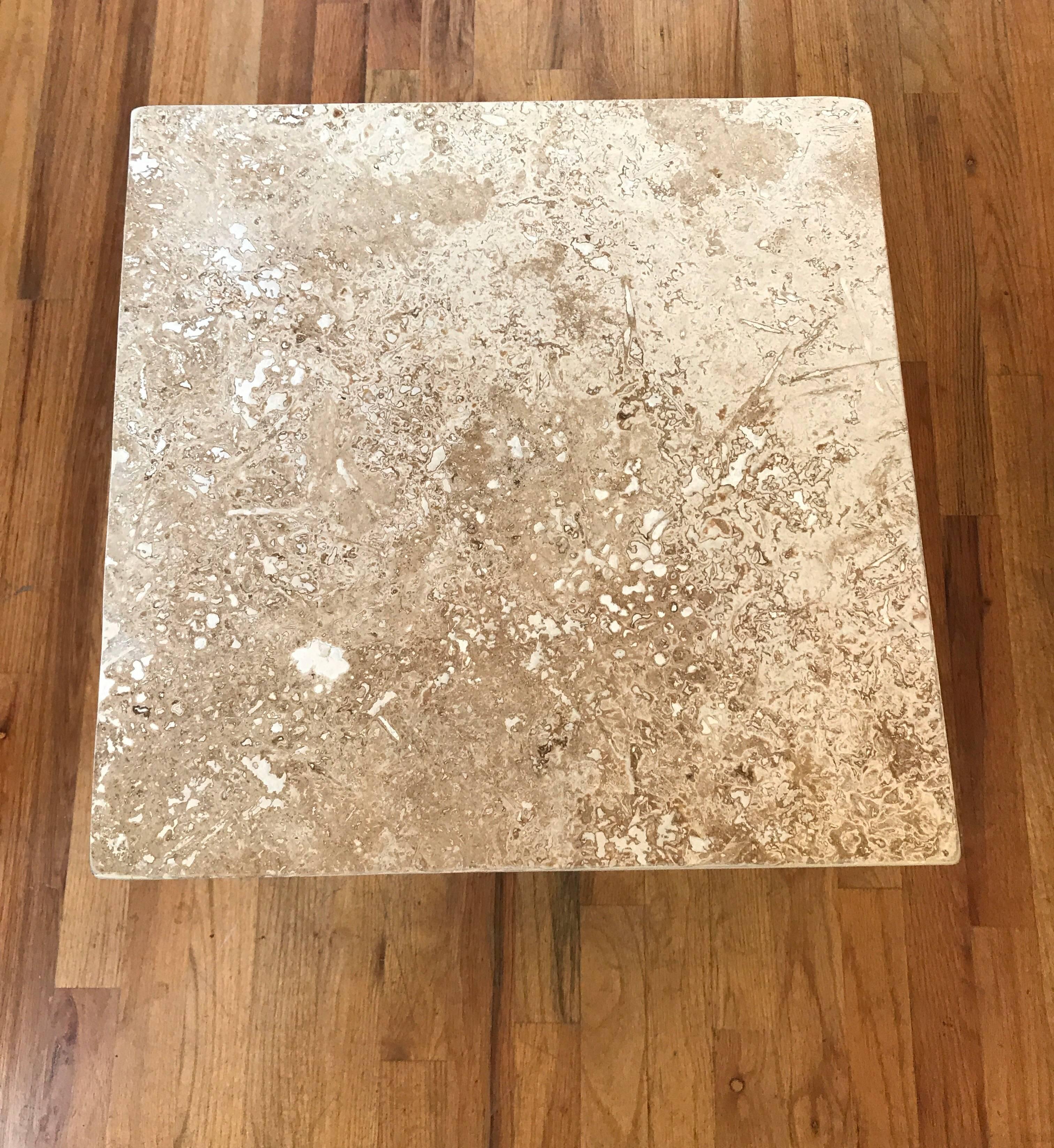 Travertine side or end table. This modern richly veined cube would make for a good drinks table.