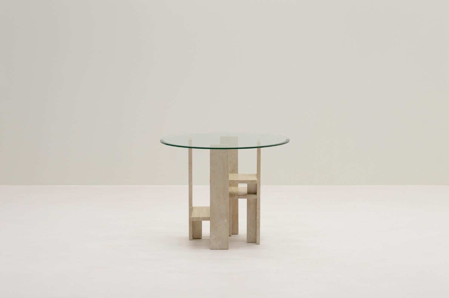 Travertine side table by Willy Ballez, 1970s Belgium. This sculptural side table was manufactured in his own atelier in Belgium. Multiple slabs of solid travertine make a beautiful base. Still with its original round glass beveled top. The table is