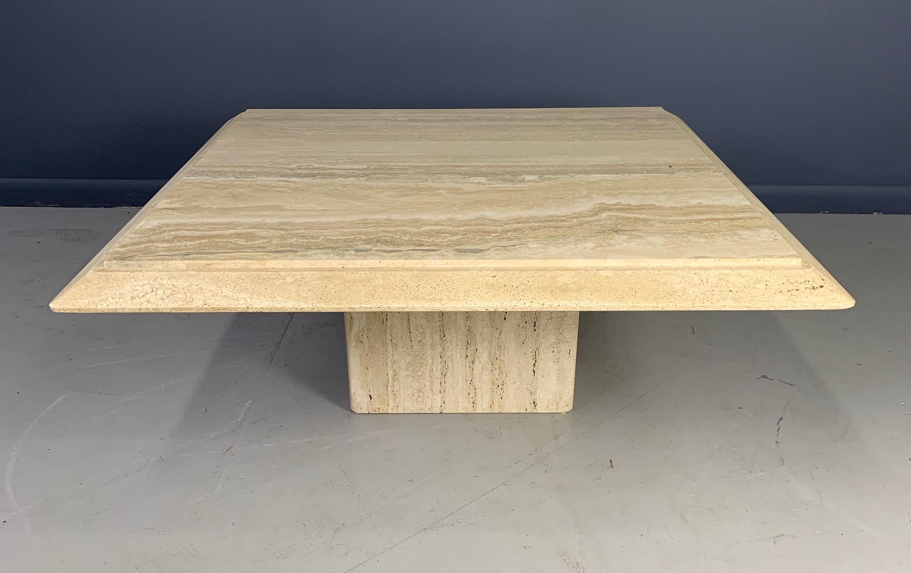 Dramatically veined travertine is the highlight of this table. The unusual unhoned edge treatment creates a visually stunning effect. The minimalistic simplicity of design would compliment many design projects.