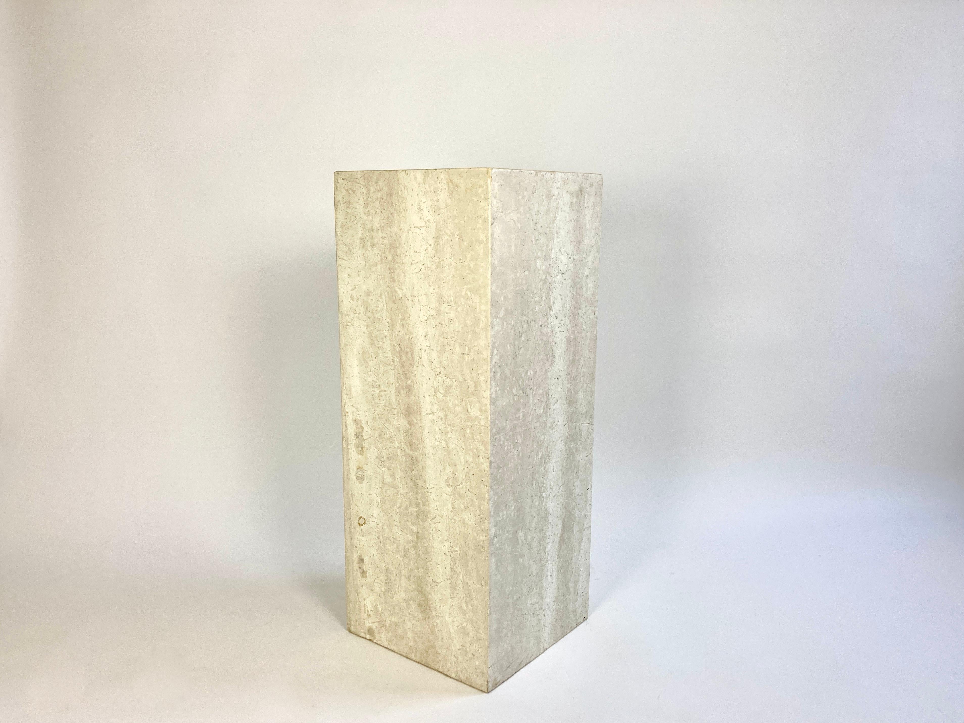 Free standing plinth in semi matt, light tone travertine stone.

Simple geometric design

Excellent condition, no damage, chips, cracks, scratches or stains. Very light signs of use (only noticeable on very close inspection).

Natural imperfections