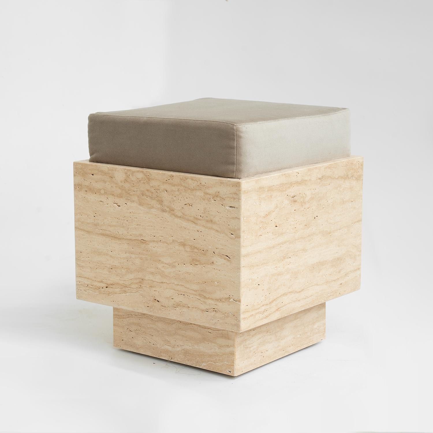 Discover the perfect blend of natural beauty and modern design with our Travertine Cube Stool. Featuring a solid travertine base with unique textures and warm tones, this versatile piece is topped with a sleek velvet cushion for added comfort and
