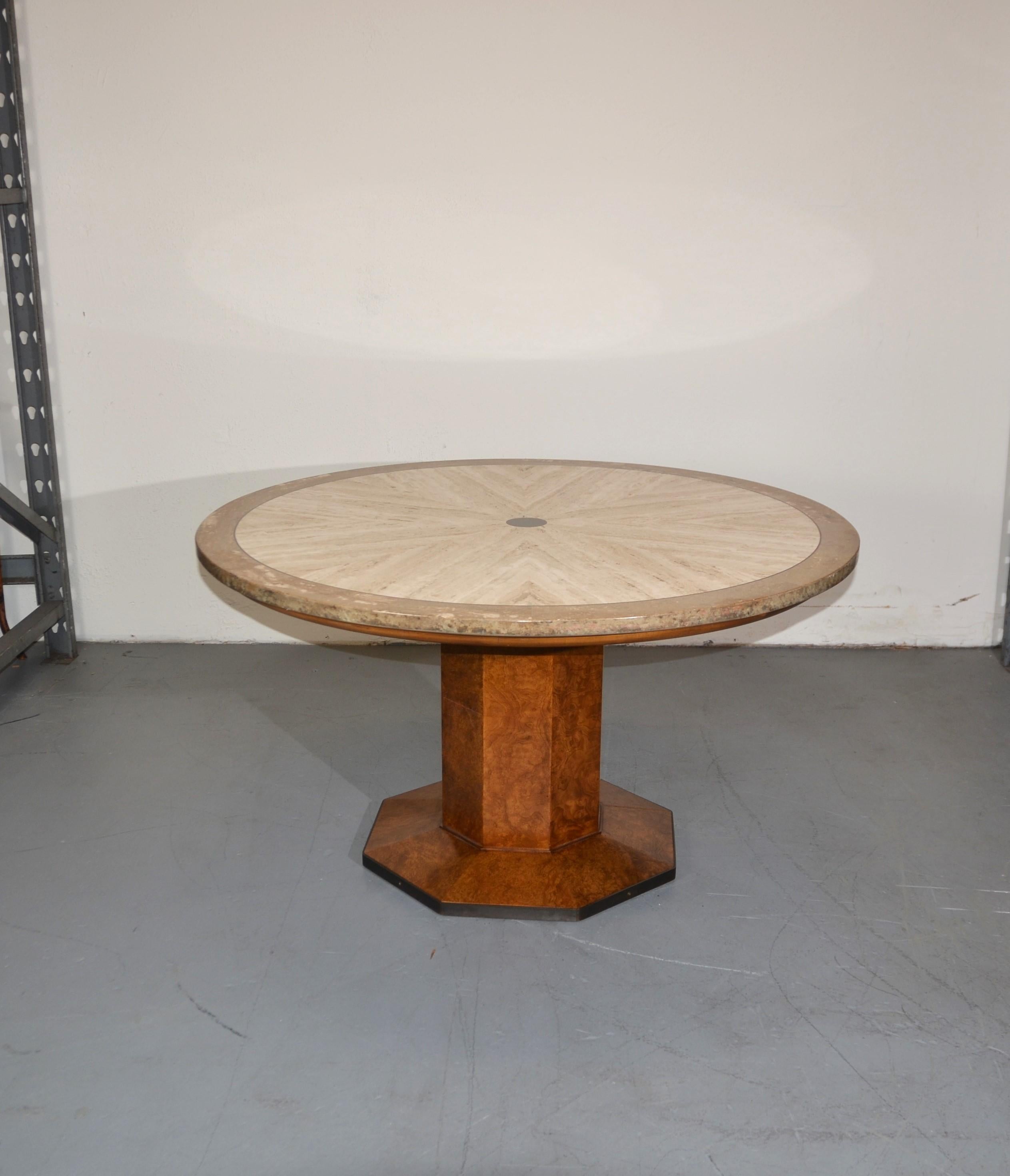Game/dining table by John Widdicomb. The travertine top rests on a burl wood pedestal base.