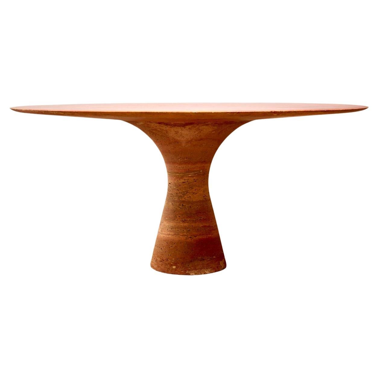 Sculptural red  travertine table. In the style of Angelo Mangiarotti

160cm diameter