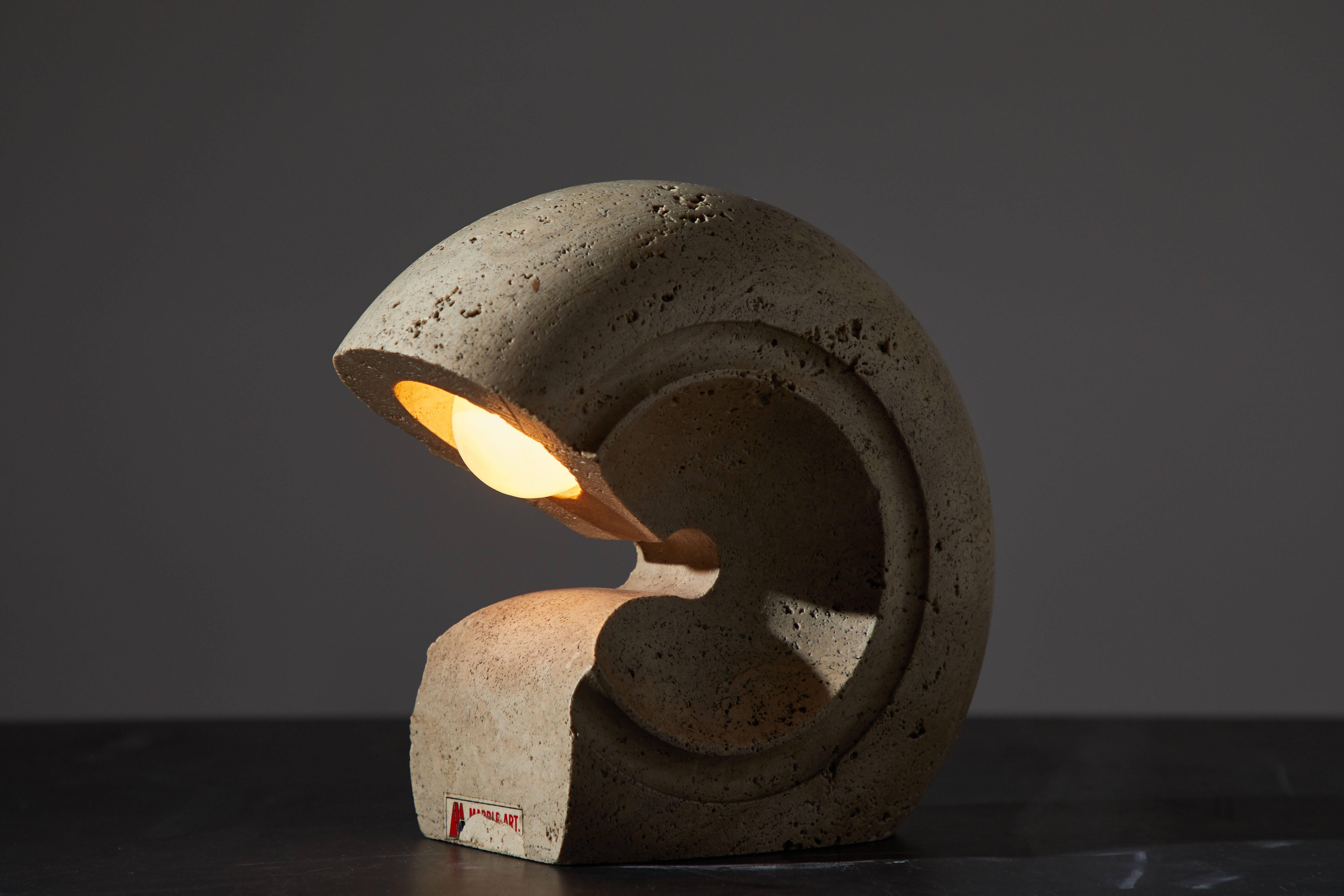Carved travertine table lamp by Giuliano Cesari manufactured for Sormani in Italy, circa 1970s. Original cord with on/off switch. Takes one E27 100w maximum bulb.
 