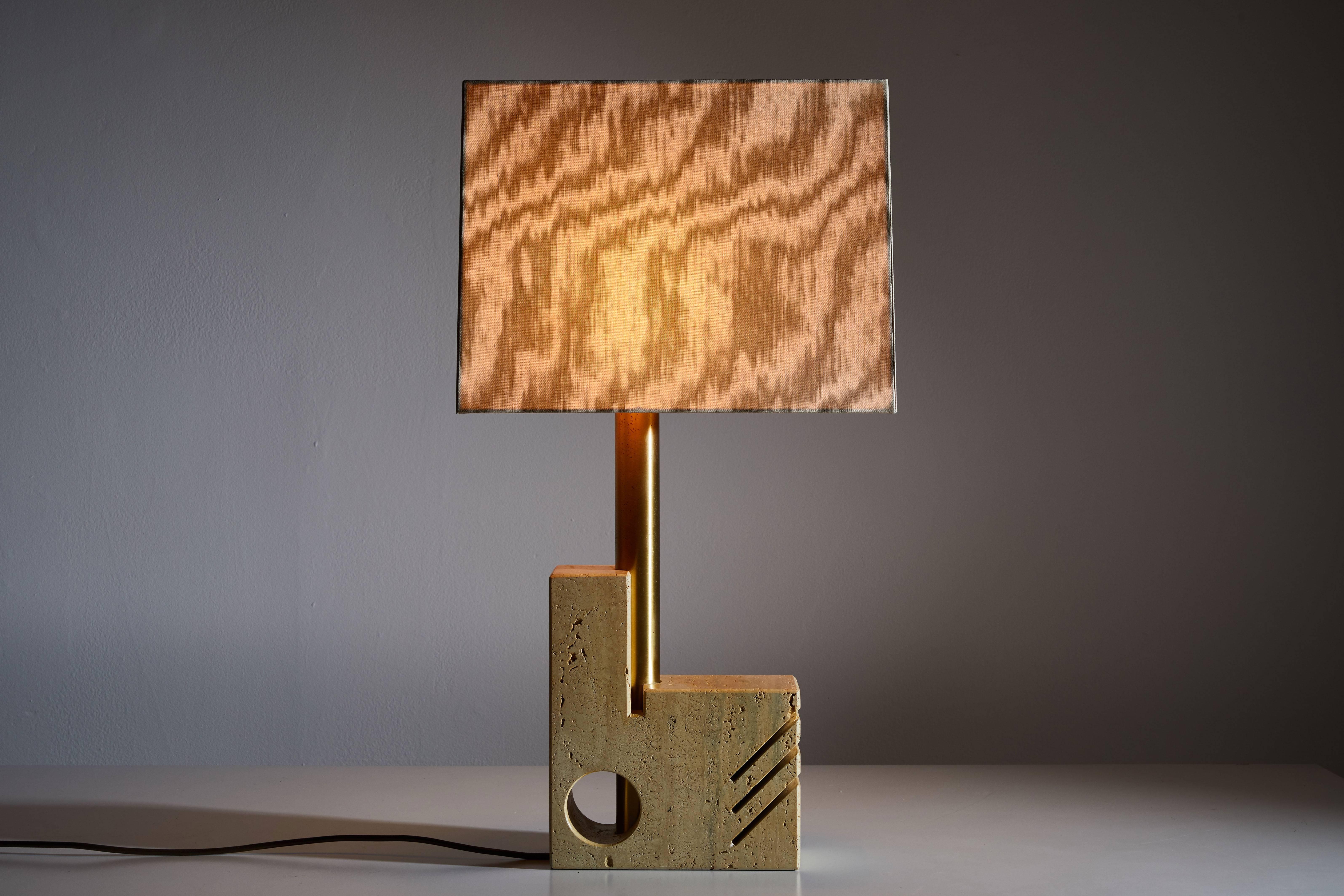 Travertine table lamp by Giuliano Cesari for Sormani. Manufactured in Italy, circa 1970's. Custom fabricated linen shade with brass hardware. Original cord. Takes one E27 100w maximum bulb. Height displayed is for fixture only.