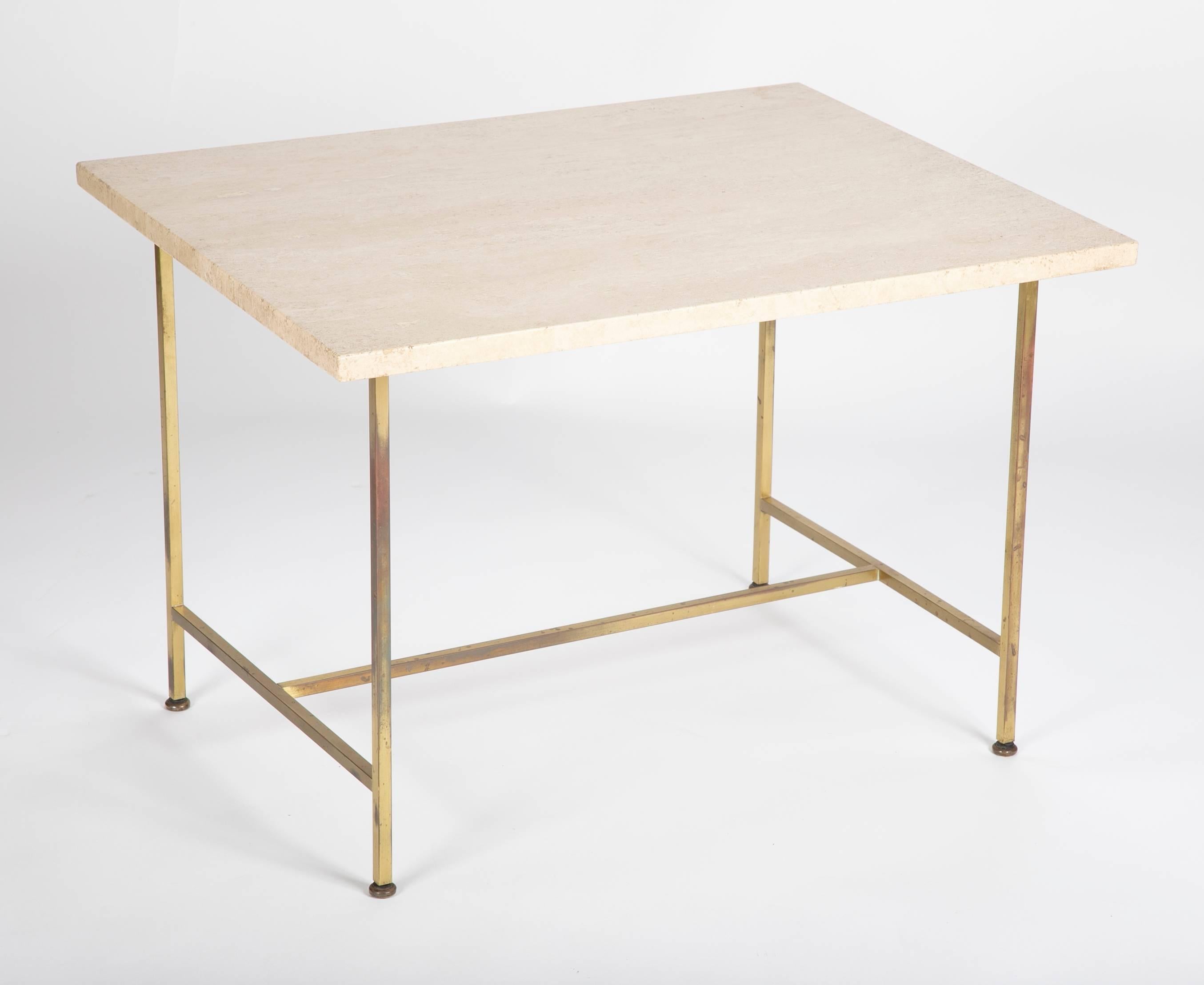 A brass and travertine side table designed by Paul McCobb.