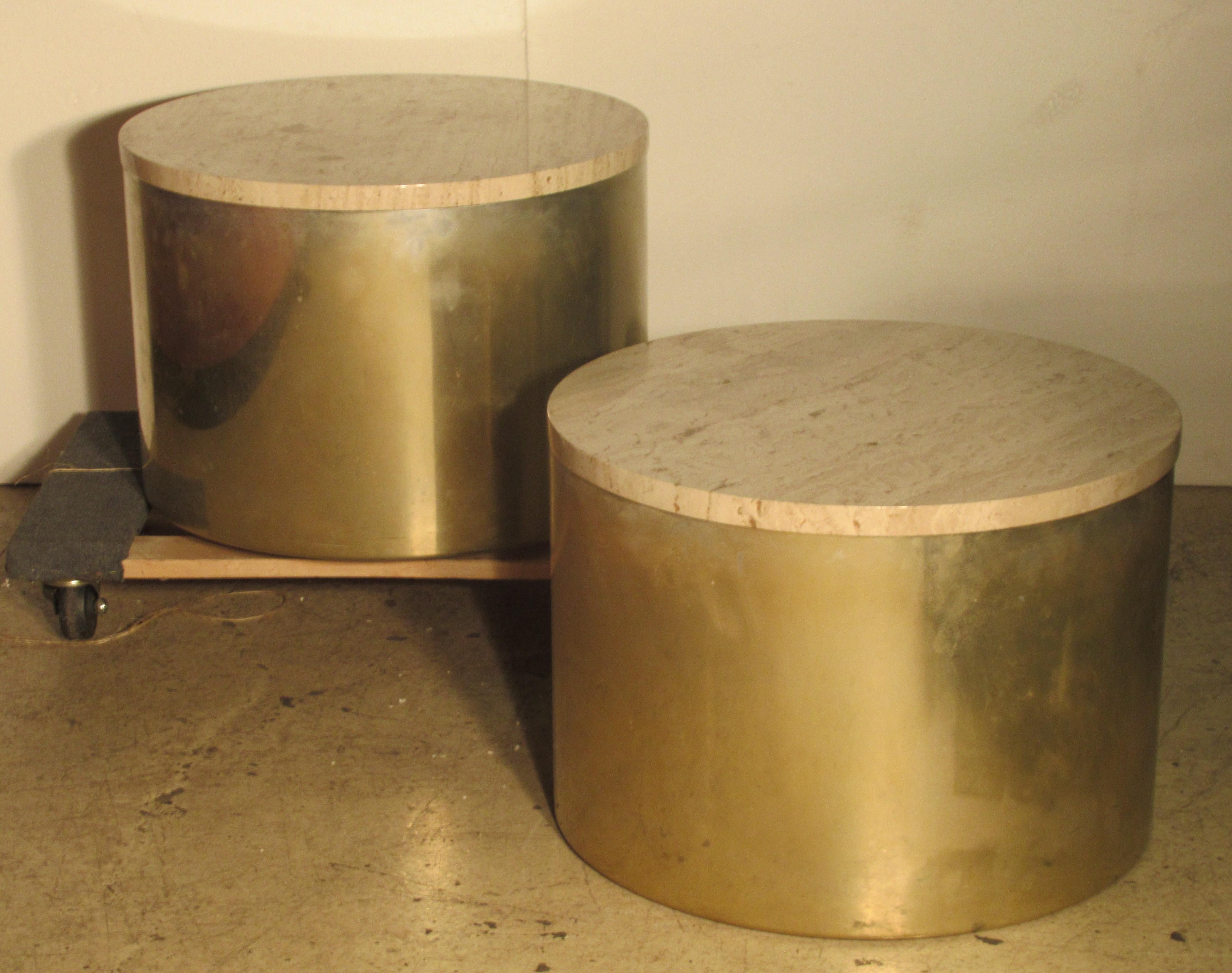 A matched pair of 1970s Minimalist designed aluminum cylinder drum tables with brass finish and removable inset travertine tops by Paul Mayen for Habitat International ( label on bottom reads Architectural Supplements - Habitat - Habitat