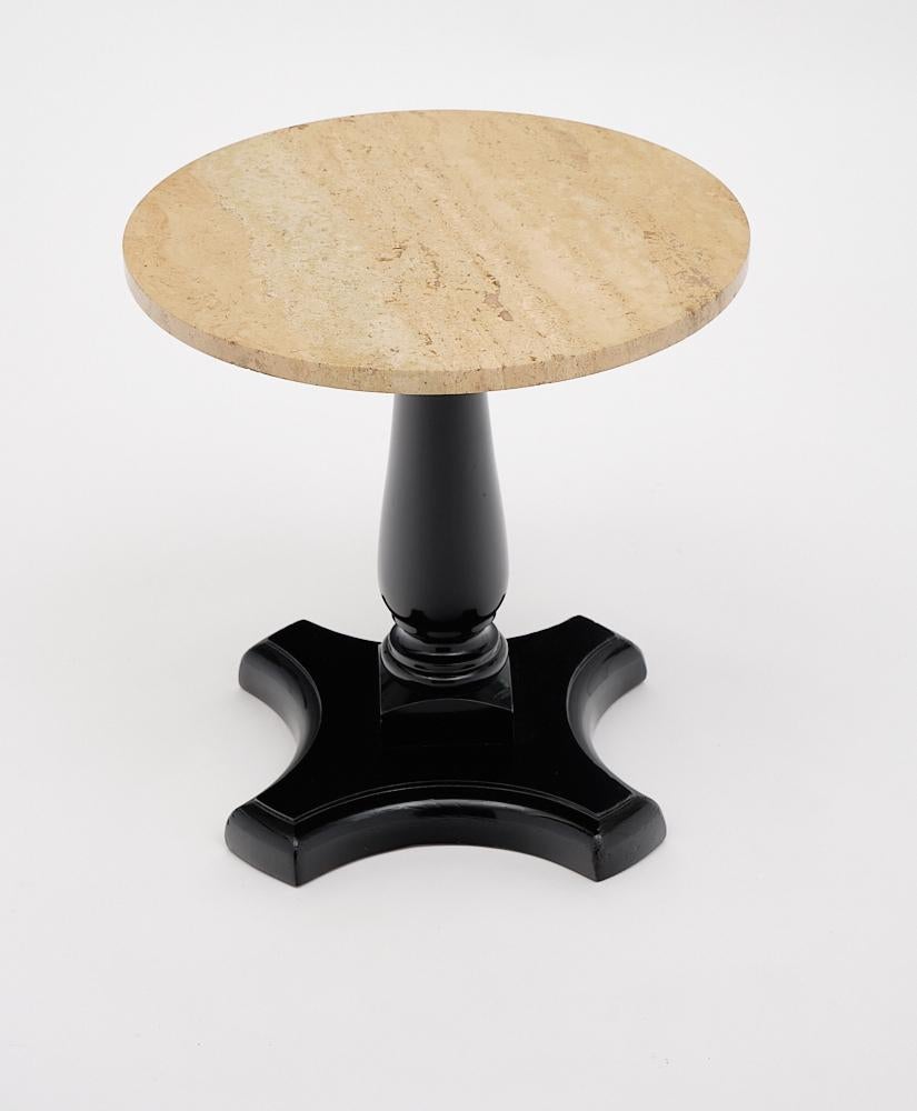 French travertine topped vintage side table crafted in solid walnut that has been ebonized and finished with a lustrous French polish. We love the travertine top!