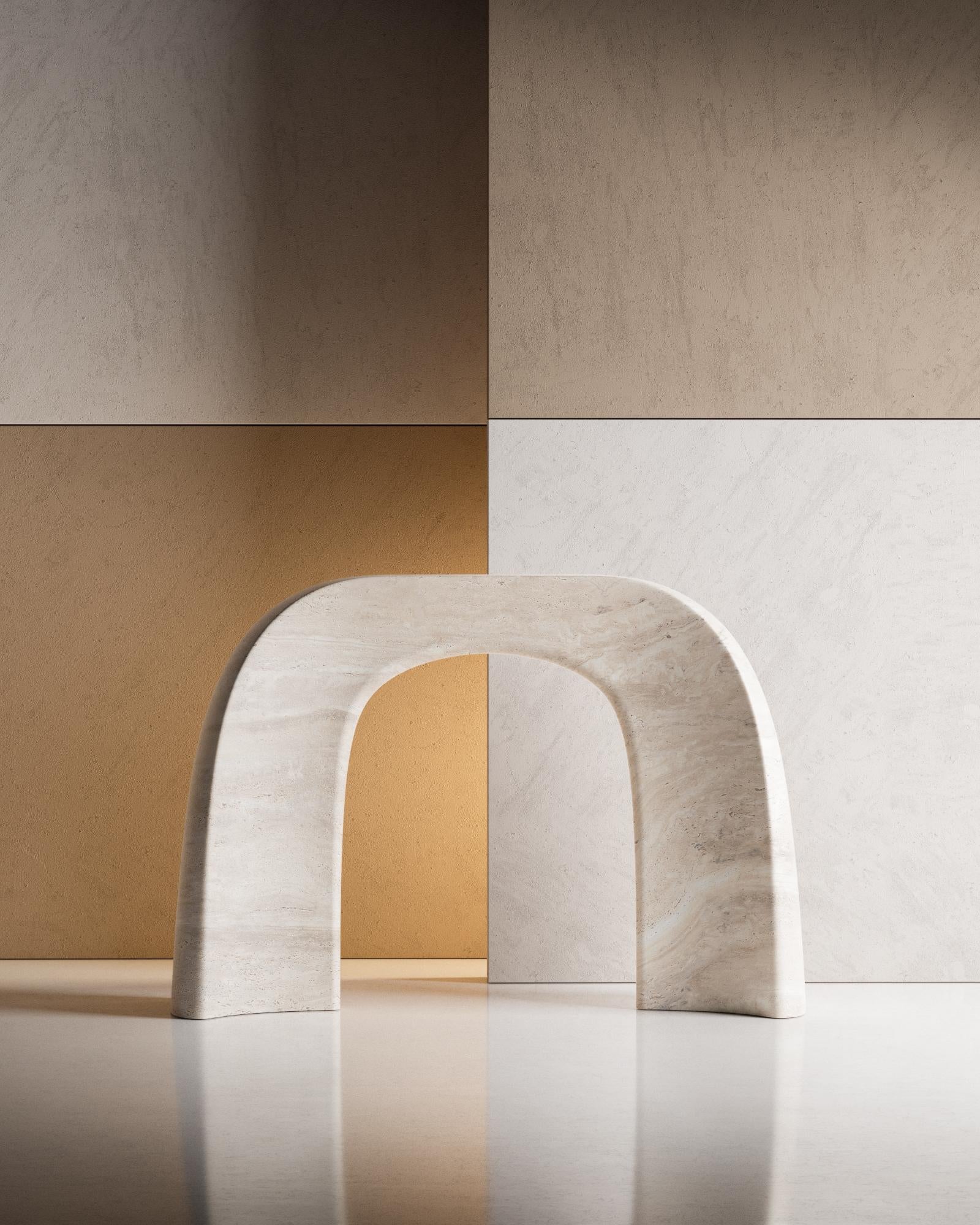 Carved from a single block of marble, the only material of which it is composed, the console carries with it the strong character of the stone. Its decisive shape rests on two massive bases and rises towards the top, maintaining continuity. The