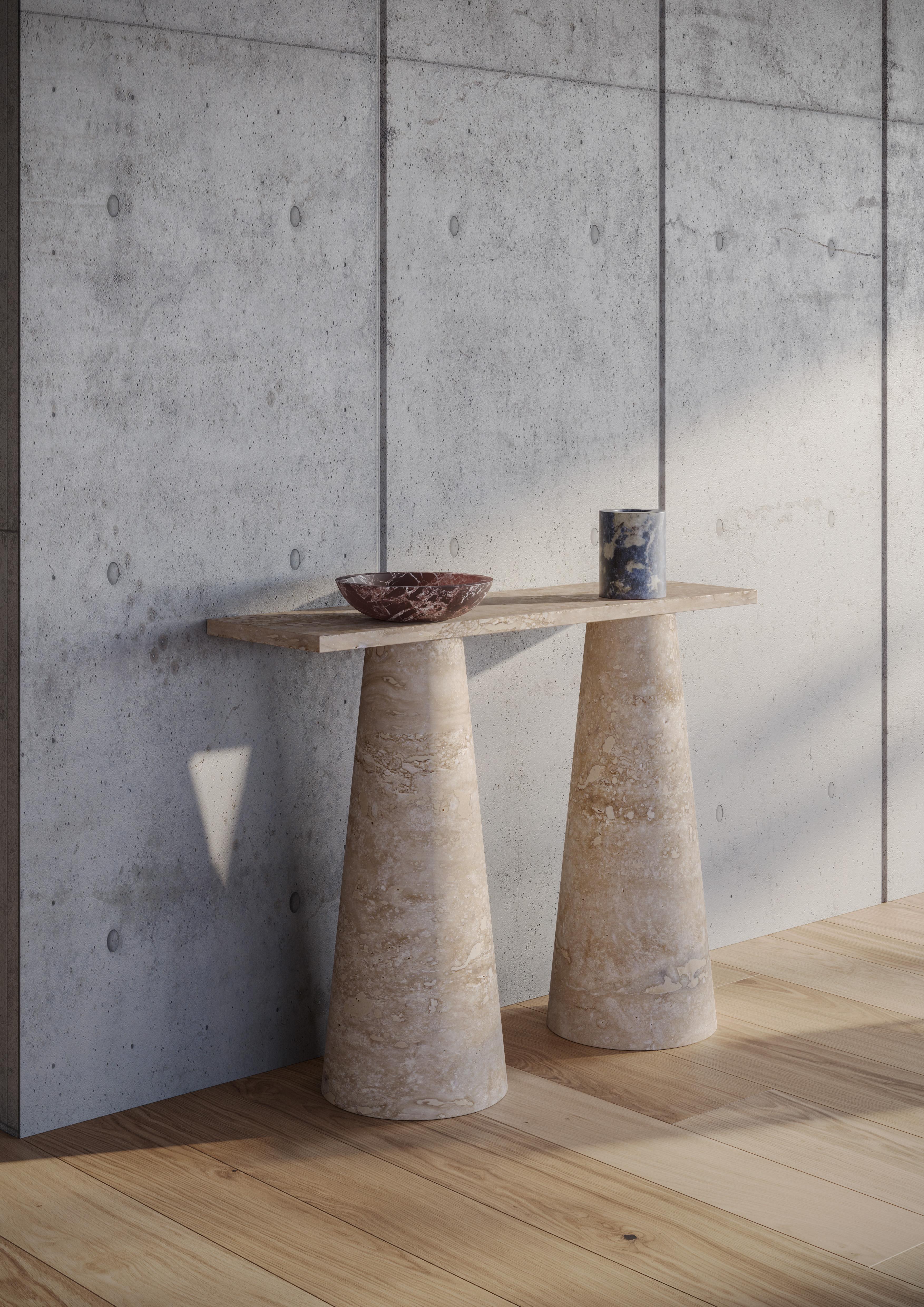 Travertino inside out console by Karen Chekerdjian
Dimensions: H120 x D36 x W90
Materials: Travertino.

Karen’s trajectory into designing was unsystematic, comprised of a combination of practical experience in various creative fields and