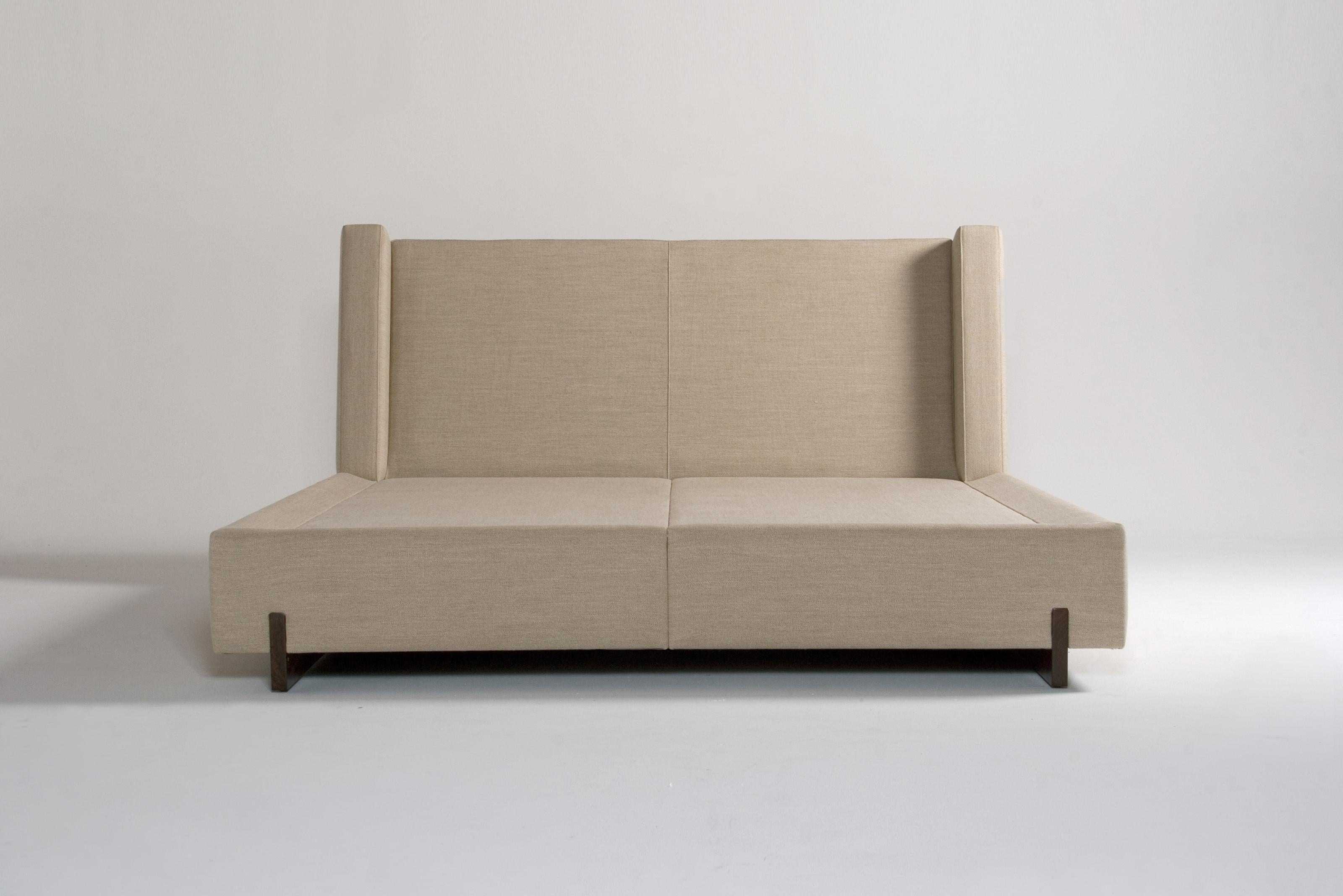 Trax King Bed by Phase Design
Dimensions: D 242.6 x W 213.4 x H 94 cm. 
Materials: Walnut and upholstery.

Solid wood legs with upholstered body. Available in walnut, white oak, or ebonized oak. Upholstery may be sourced in Customer Own Material