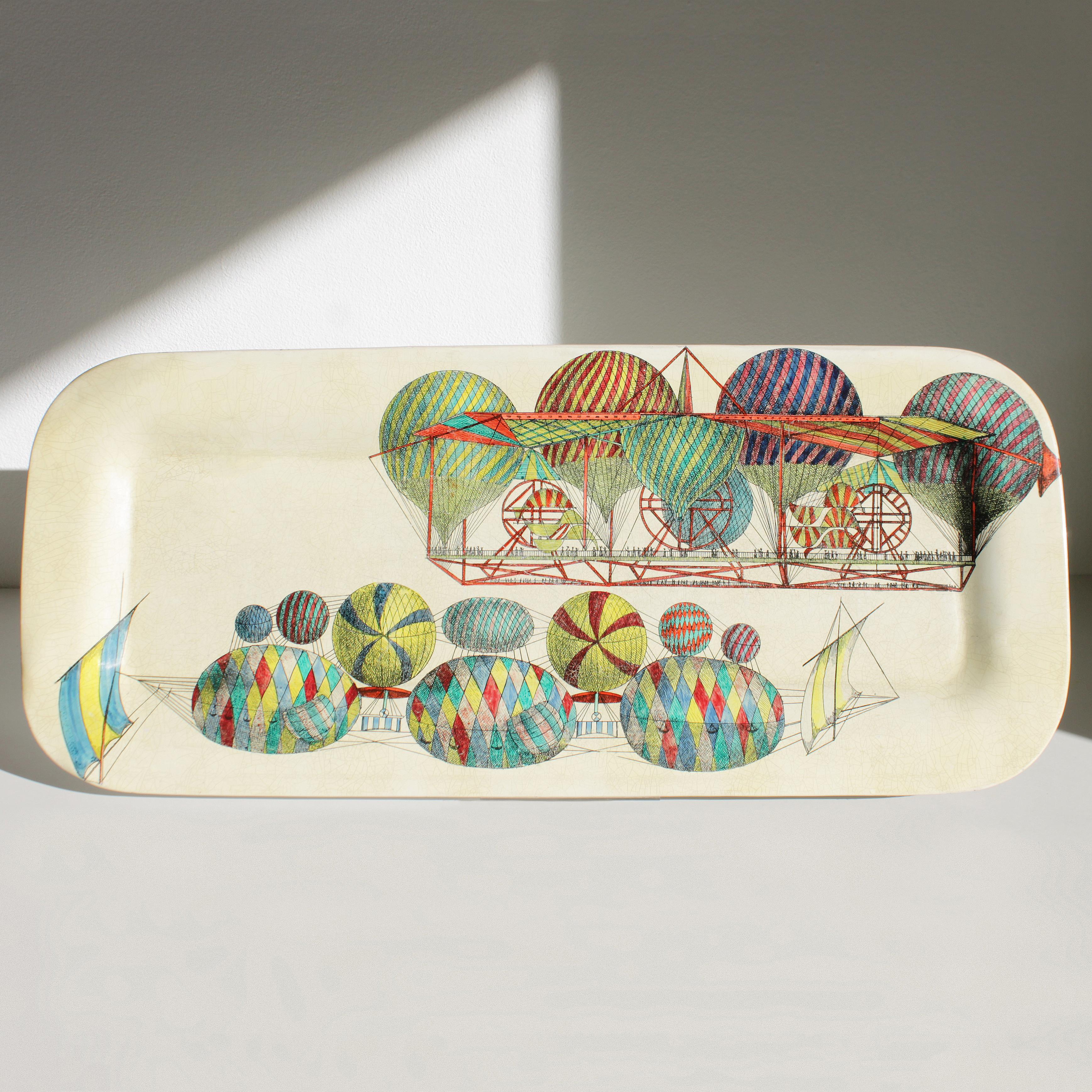 Original metal tray by Piero Fornasetti, Milano Italy. This is a rare first production called 'Palloni' (hot-air balloons) from the early 1950s. Marked. 
Dimensions: length 23.6 in. (60 cm), width 10.0 inches (25,5 cm).

Piero Fornasetti