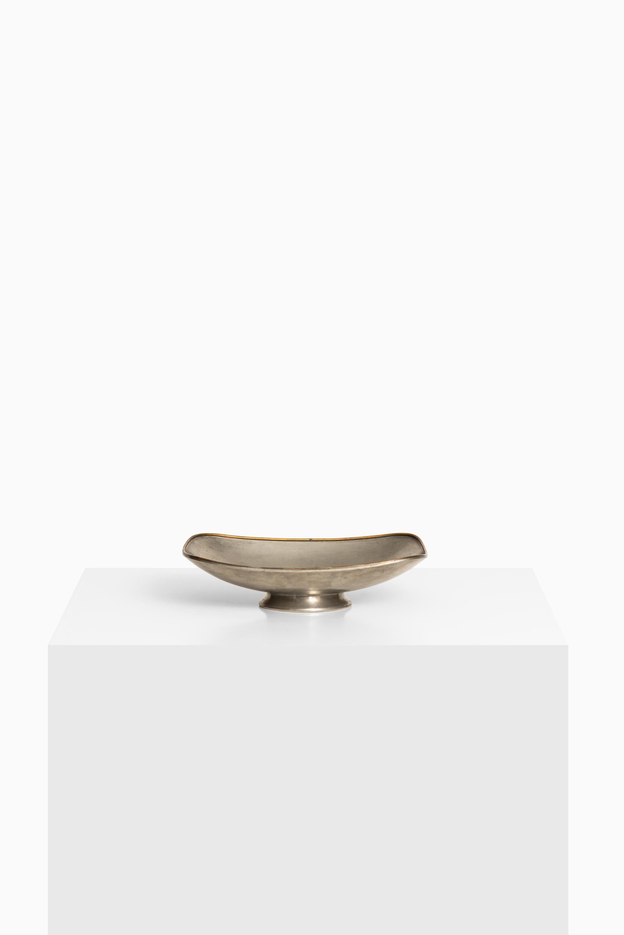 Tray in pewter and brass rim. Produced by Svenskt Tenn in Sweden.