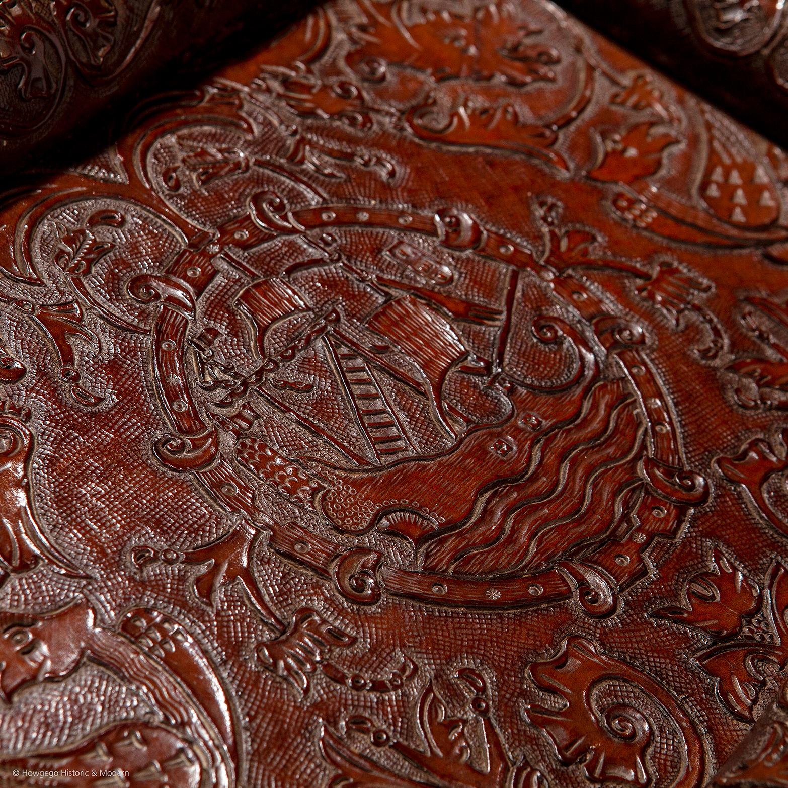 - Very unusual Baroque Revival leather tray of nautical interest
- Characteristic Baroque design featuring a sailing galleon surrounded by mythical birds, tulips, acanthus and oak leaves
- Beautifully worked in deep relief
- In excellent original