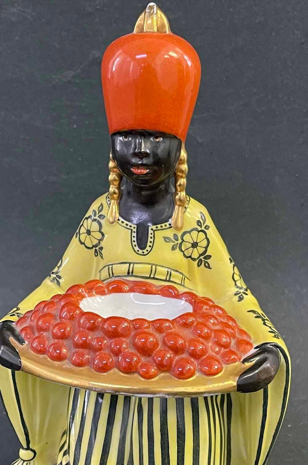 For a French woman in the 1920s, this figure of a turbaned North African woman, resplendent in a yellow robe and carrying a tray loaded with oranges, would have been exotic and fascinating.  The sculpture was designed to be internally illuminated. 