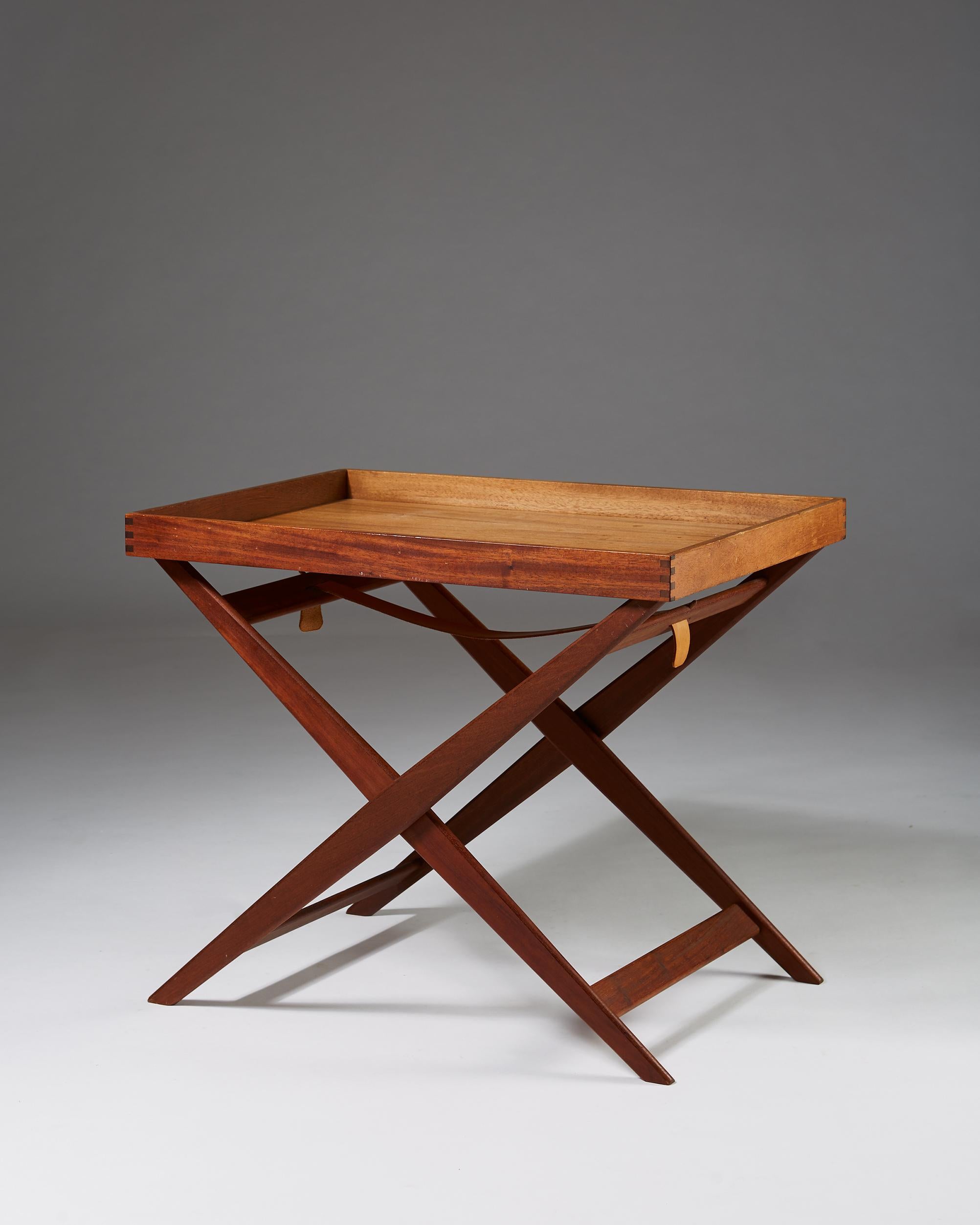 Tray table, anonymous, for Rud Rasmussen, Denmark, 1960s. Mahogany. 

Height adjustable.

 