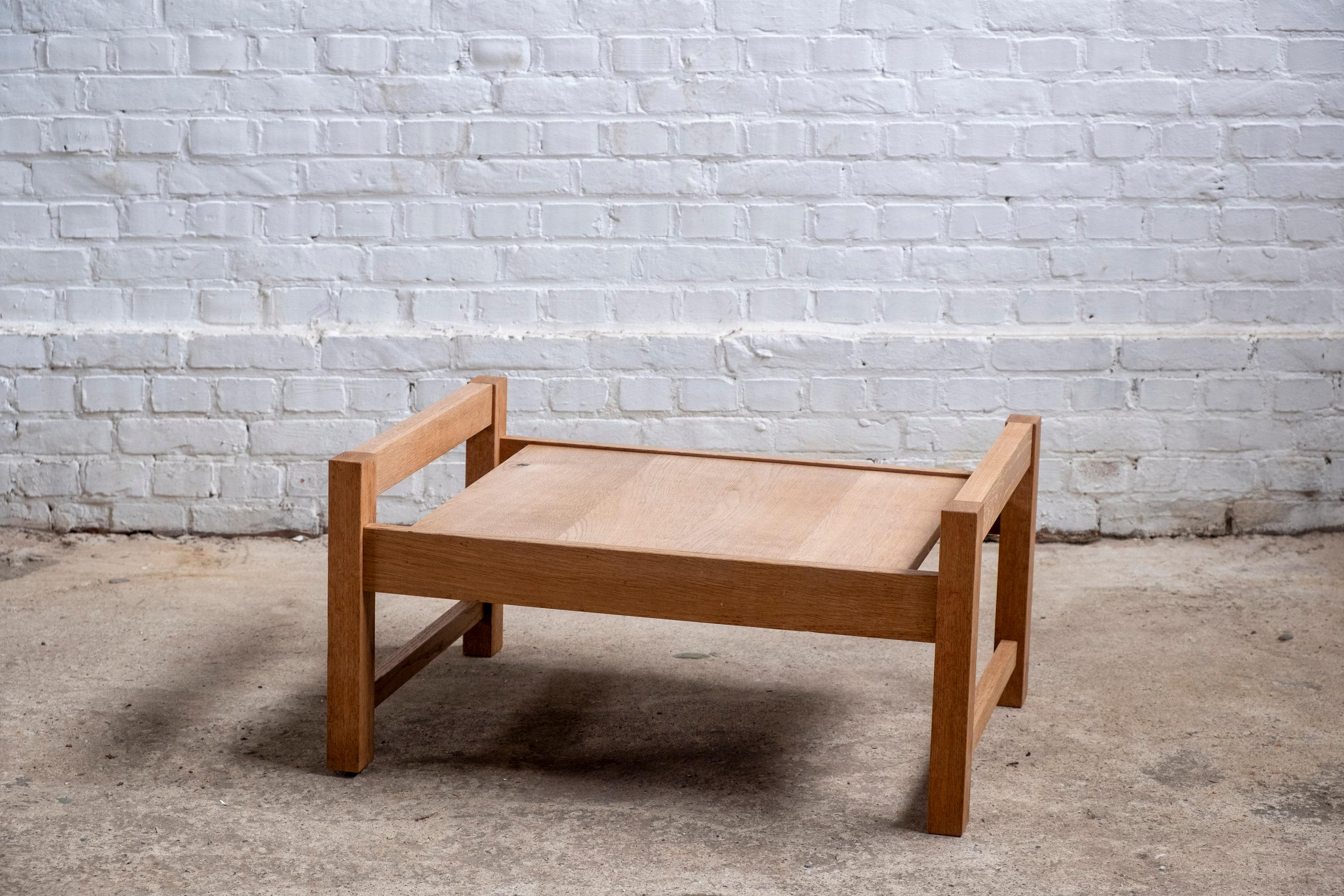This rare and beautifully crafted low tray table was made in the 1960s by Van Den Berghe-Pauvers in Belgium. Its unique proportions and elegant design make it both functional and versatile. The table's height allows for easy use on top of another