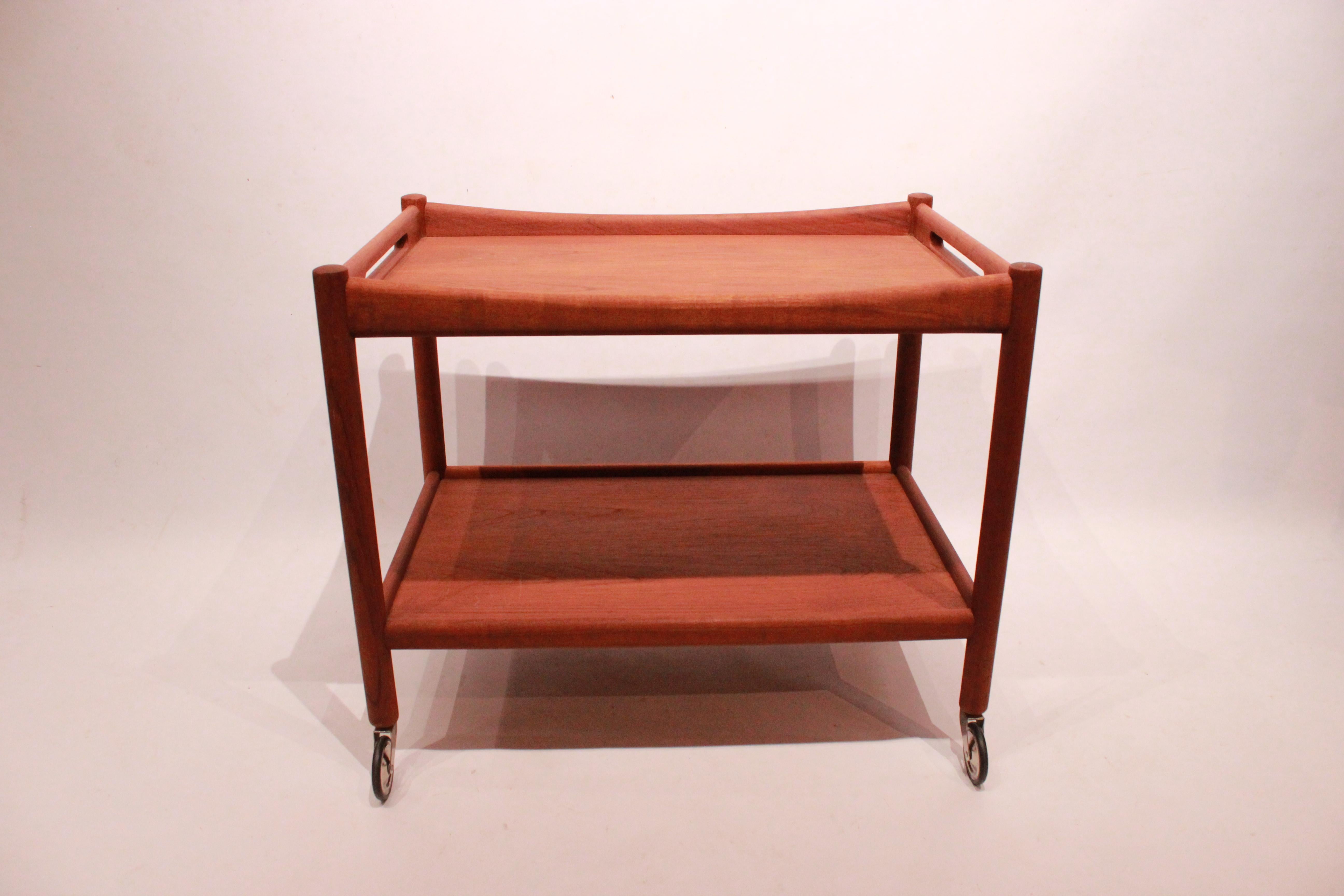 Tray table in teak designed by Hans J. Wegner from the 1960s. The table is in great vintage condition.