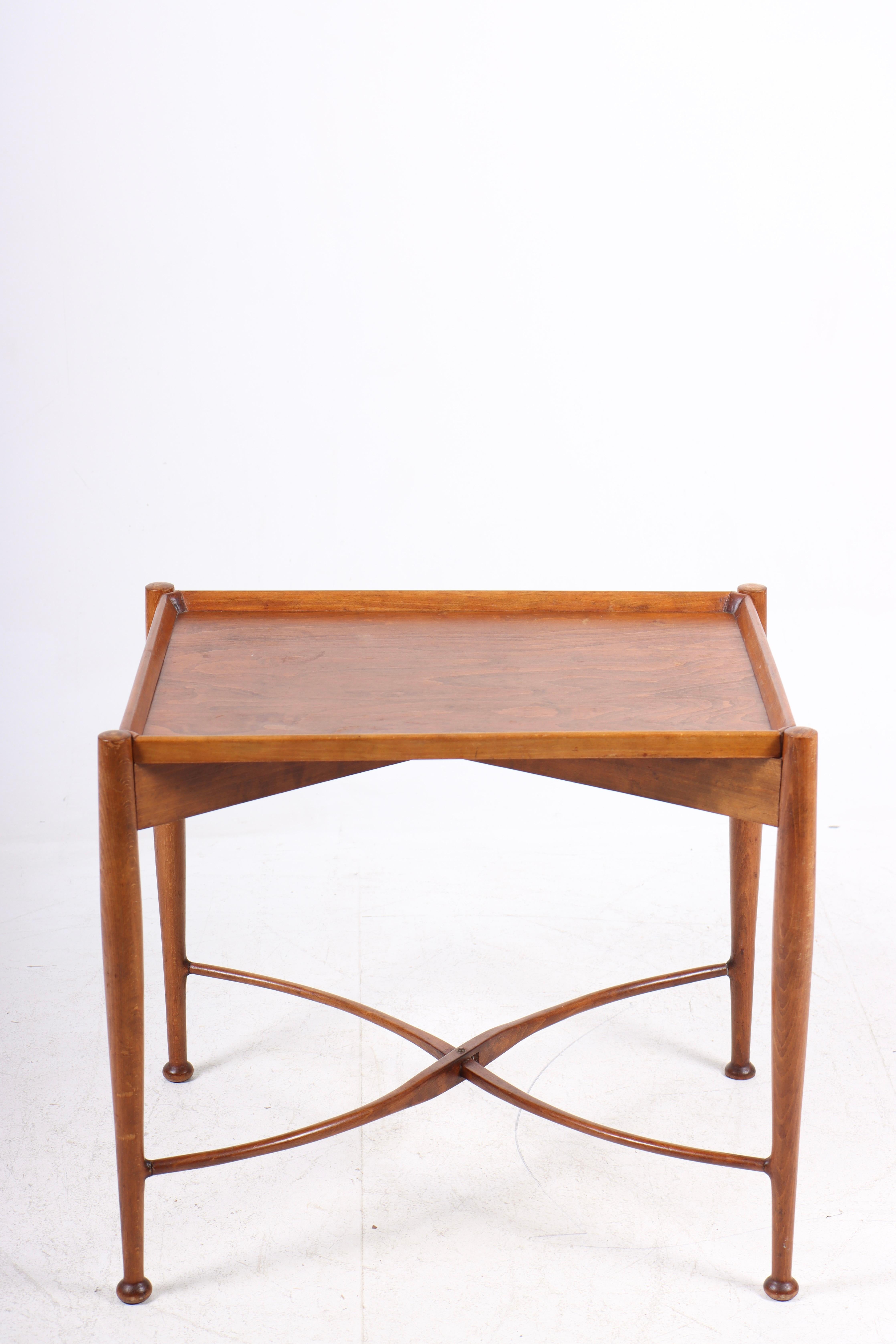 Tray table in beech. Designed and made in Denmark in the 1950s. Great original condition.