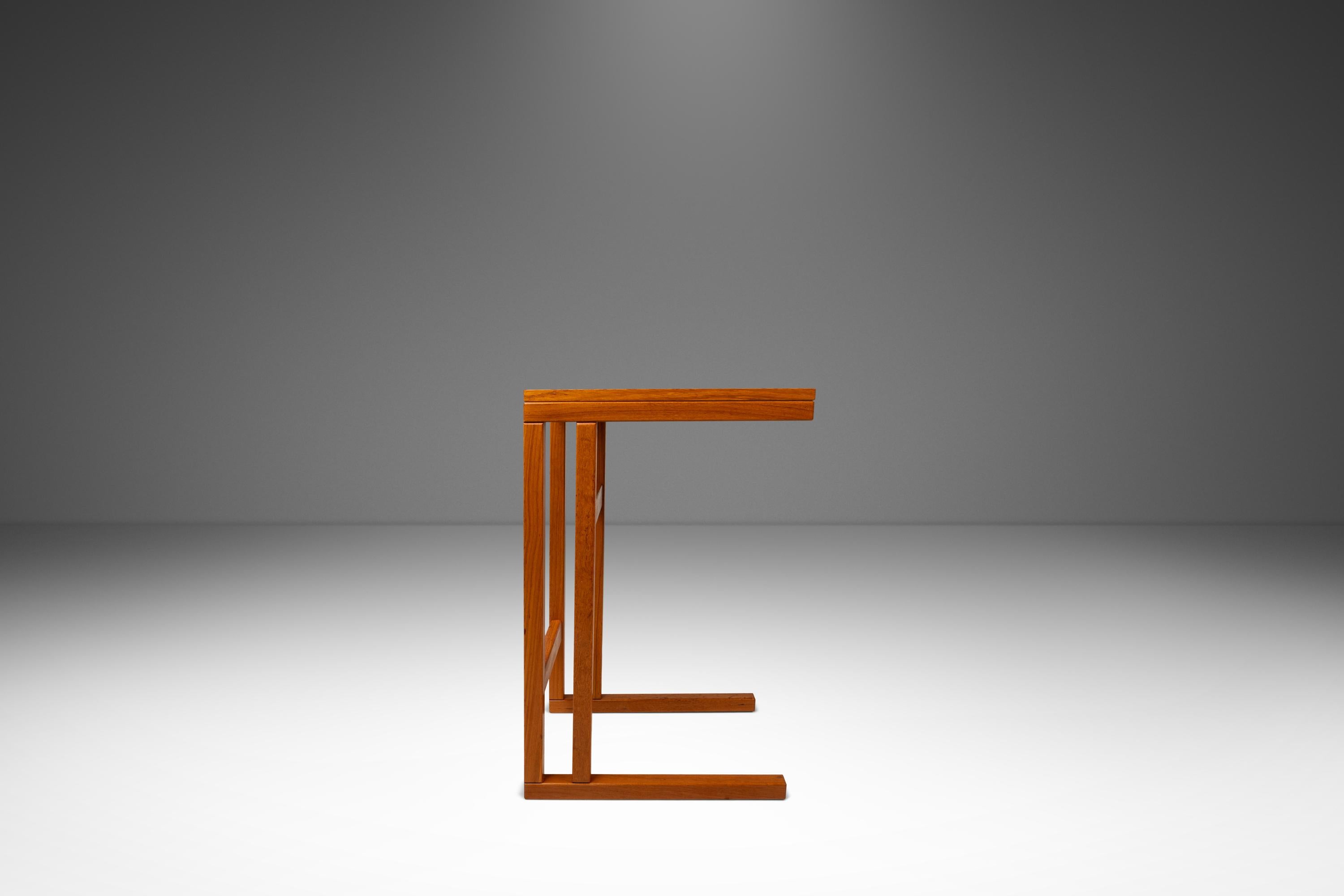 ntroducing a splendid Danish-made tray table constructed from a mix of solid and matchbook-veneered Burmese teak. Produced in the mid-80's by FBJ Møbler this ultra-functional table is ideal for crafters or those who work from computers. Its